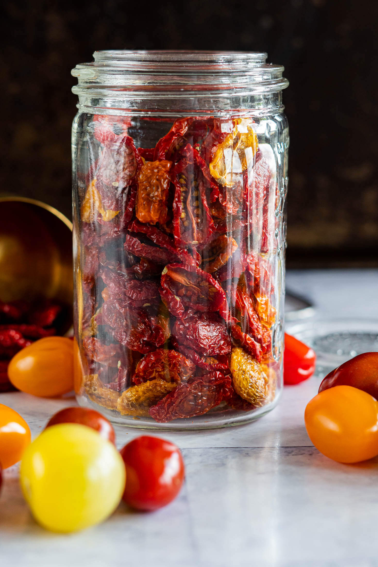 Dehydrated cherry tomatoes in a mason jar.