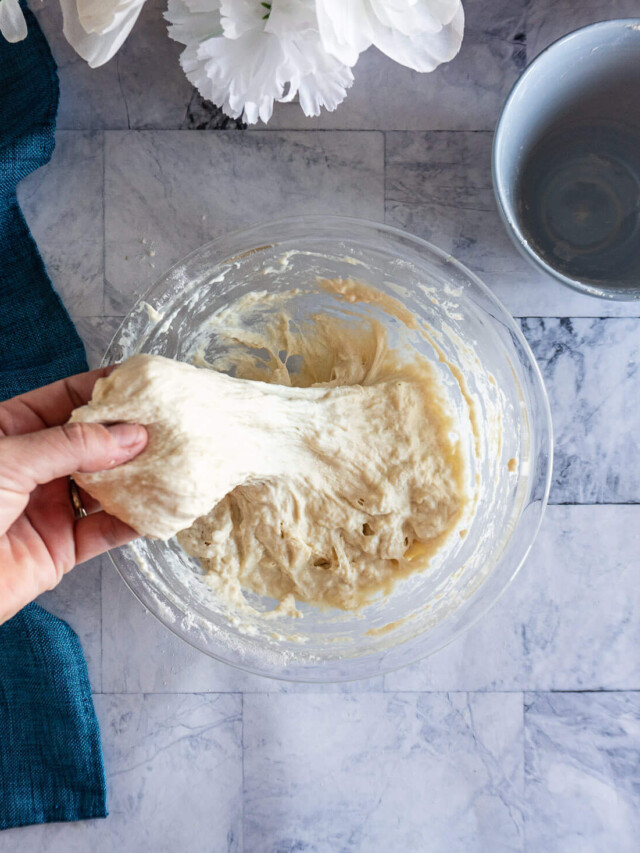 Stretching dough after autolyse.