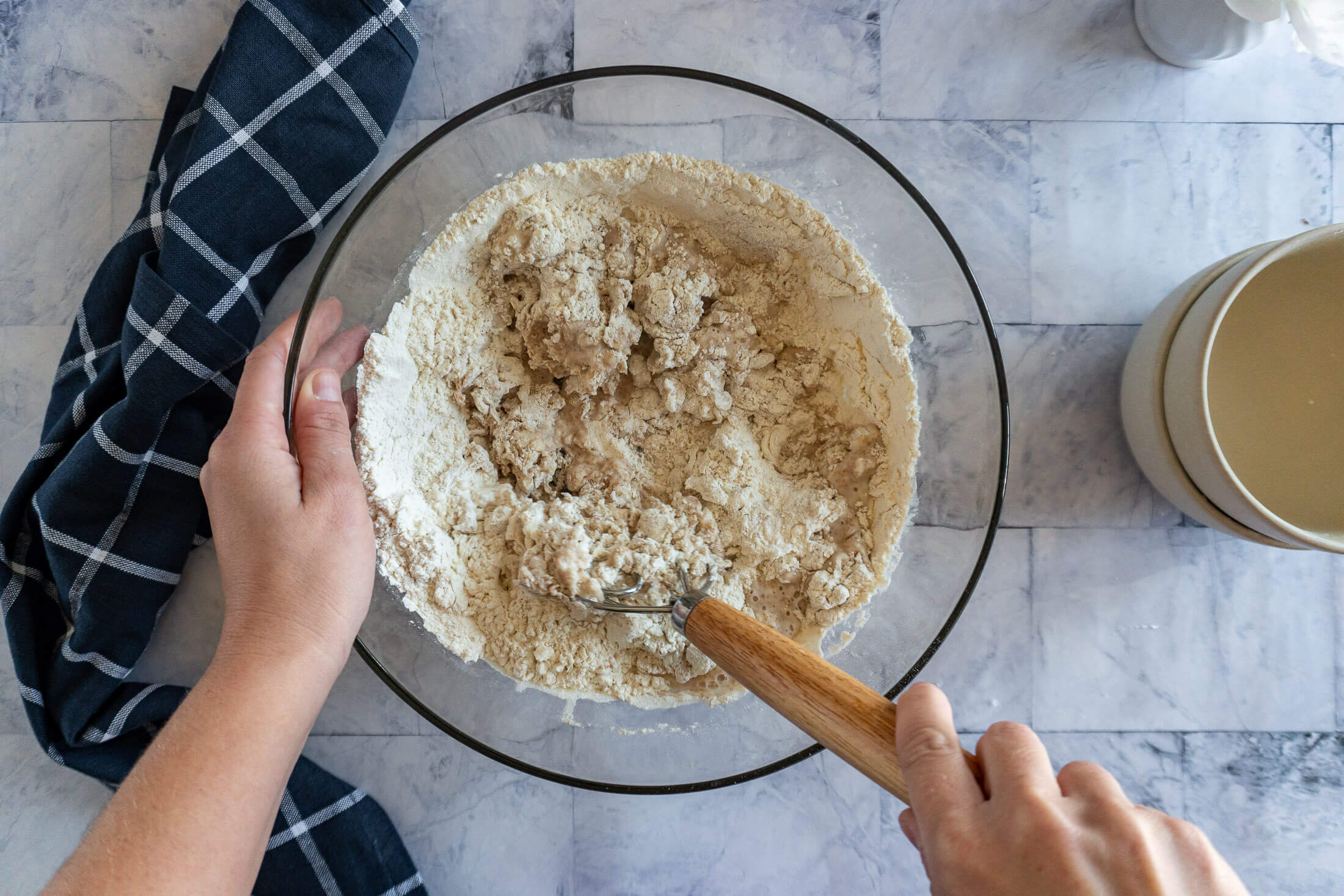 Mixing flour into the water.