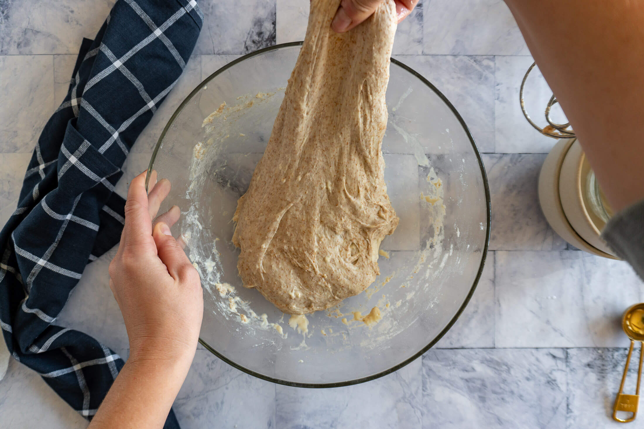 Pulling up the dough for a stretch and fold.