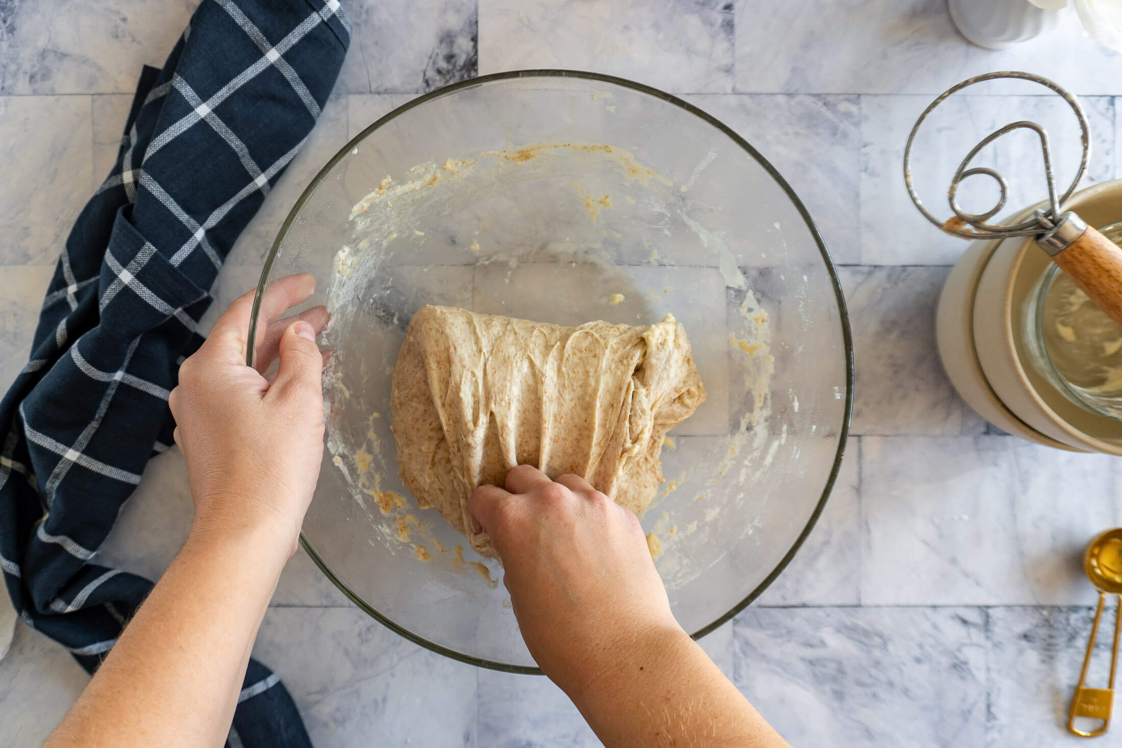 Folding the dough over itself.
