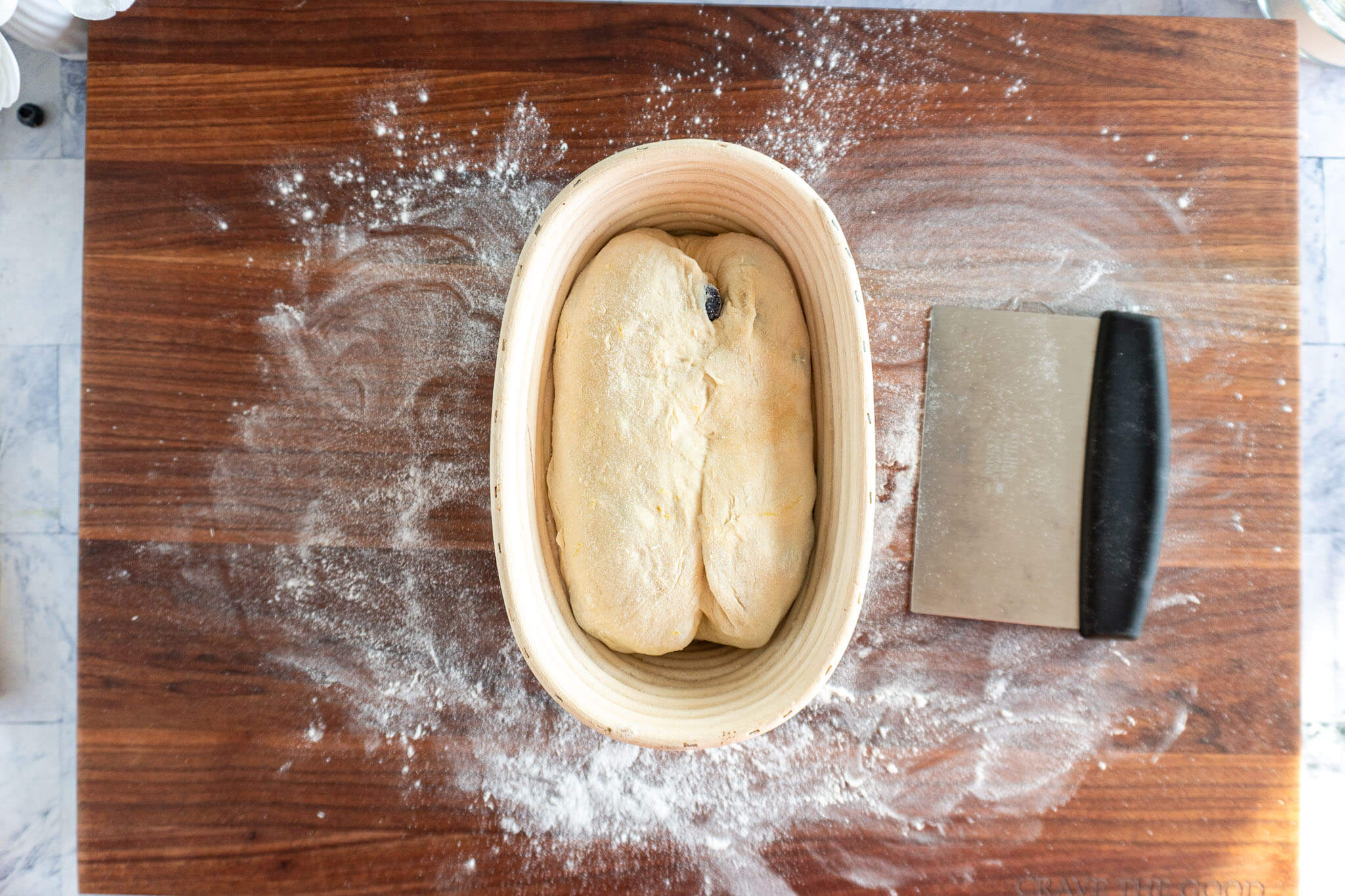 Transferring dough to floured banneton.