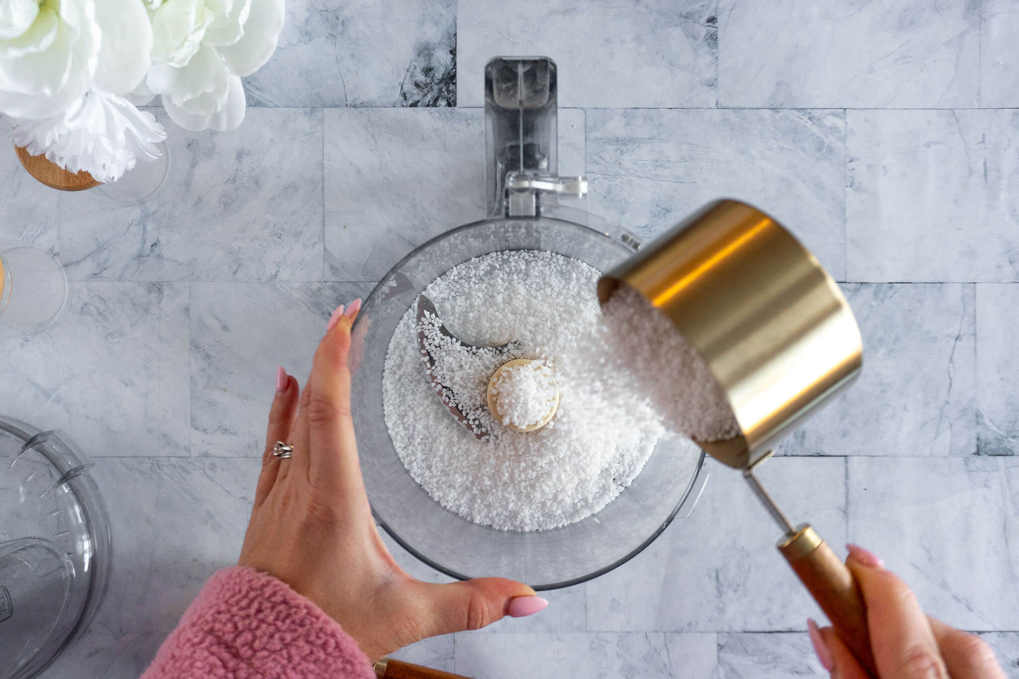 Adding salt to food processor.