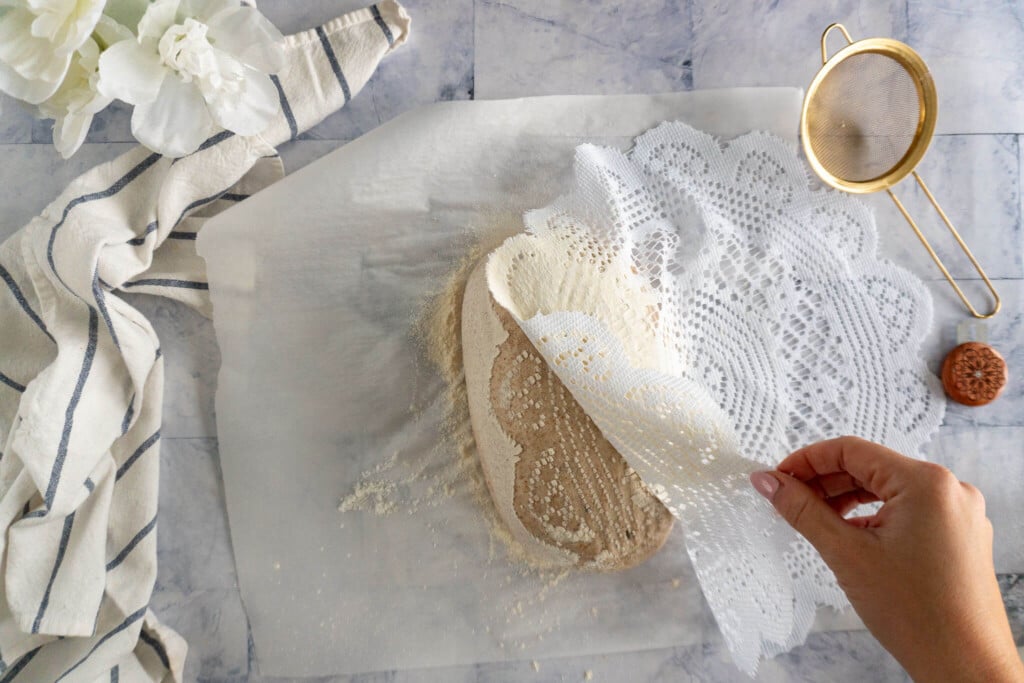 carefully removing doily. 