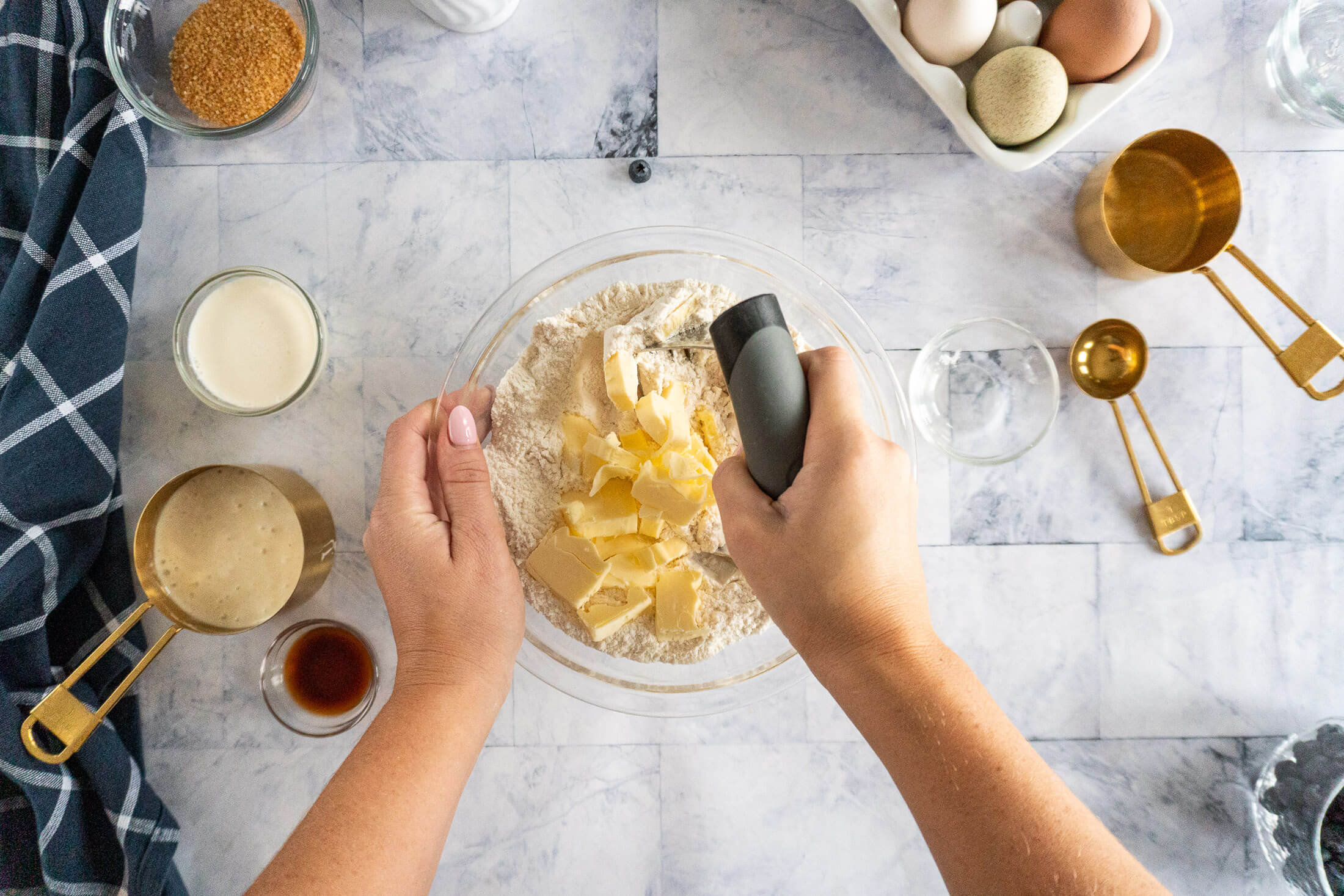 Cutting in butter with a pastry cutter.