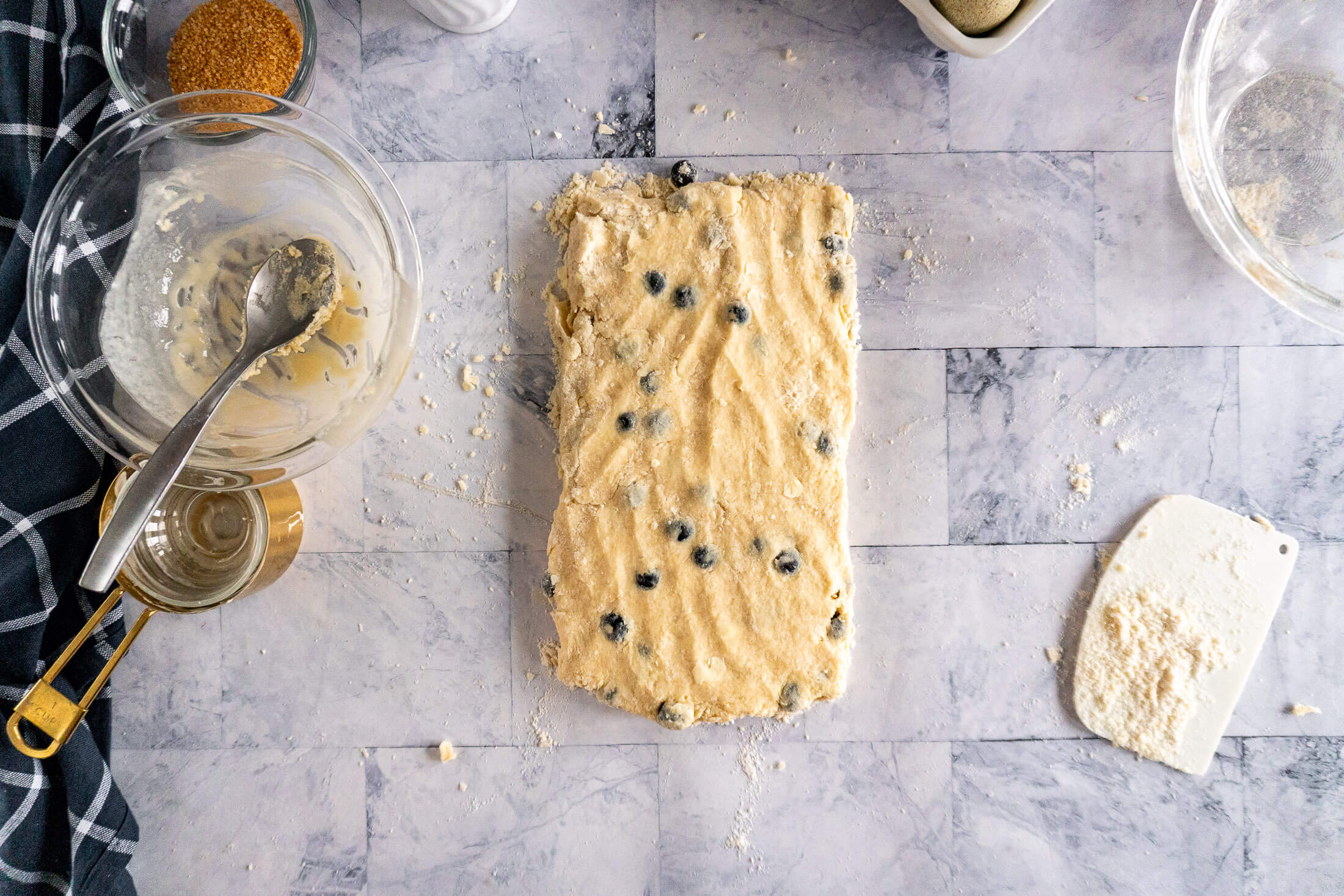 Pressing dough flat.