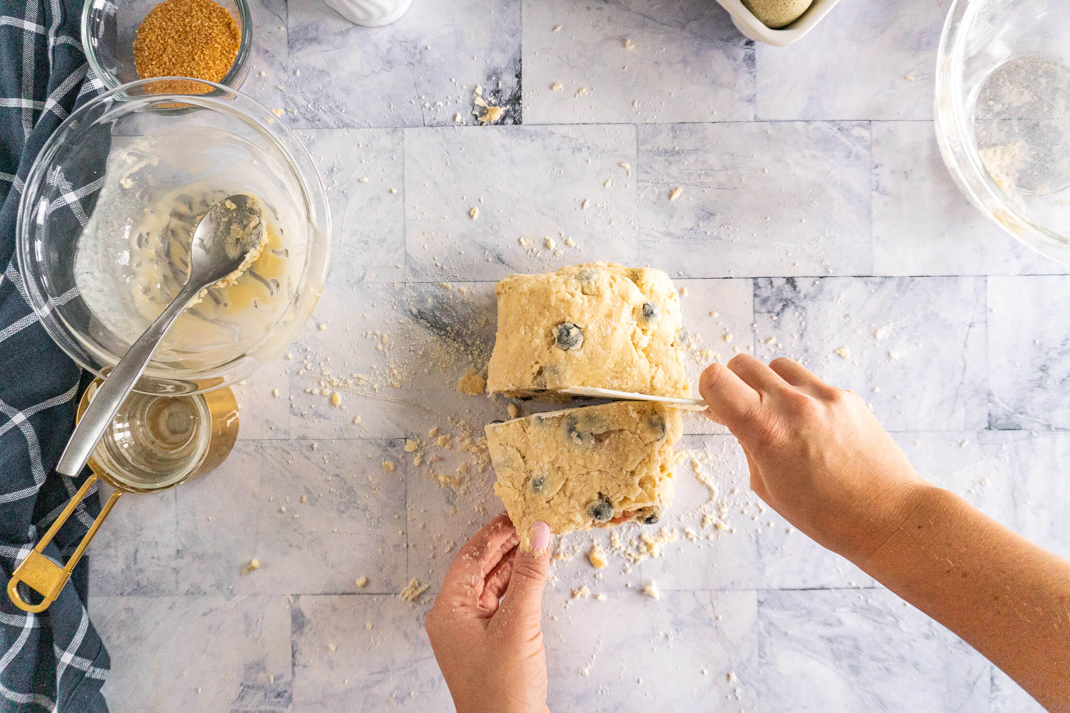Slicing the folded dough in half.