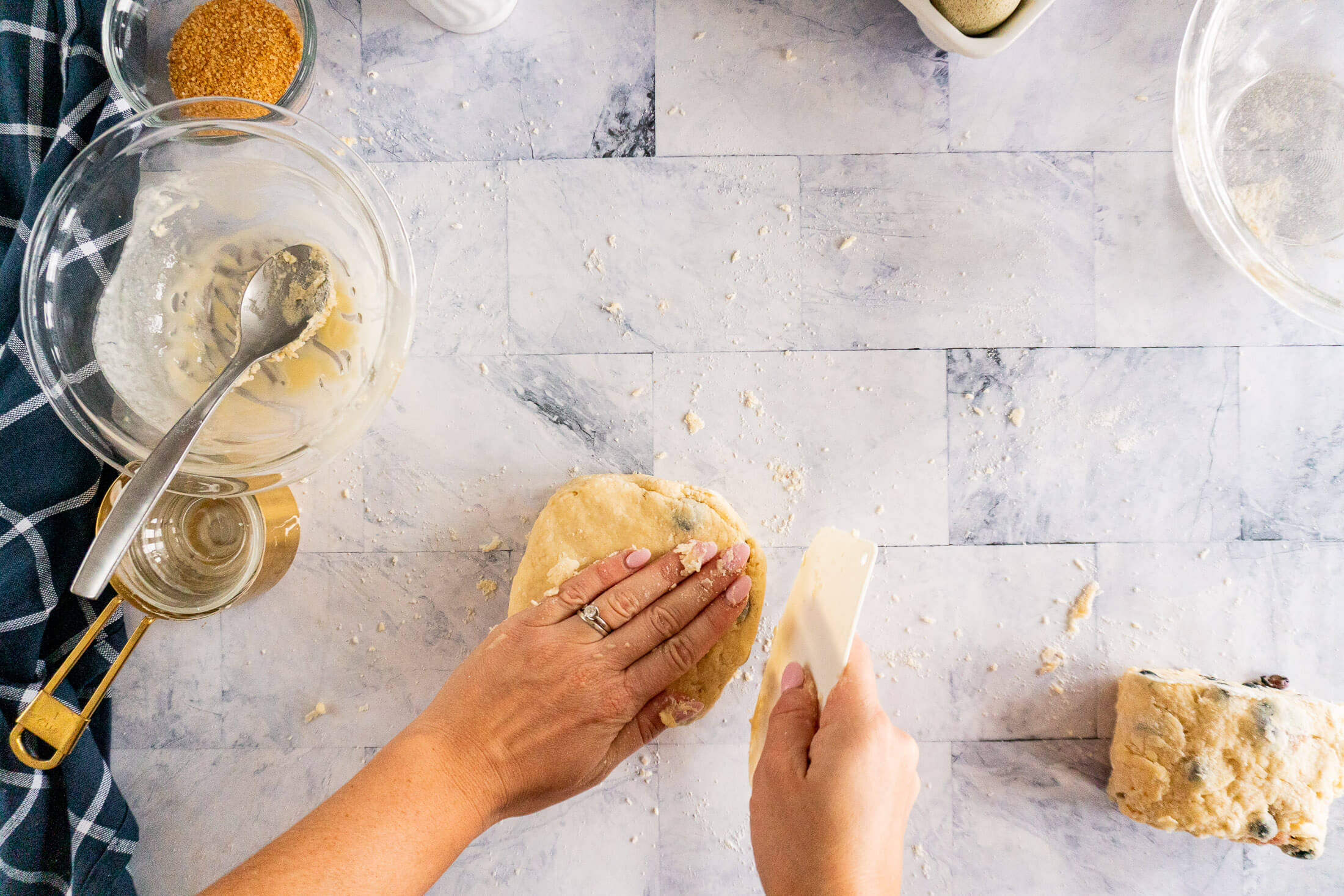 Pressing dough into a round circle.