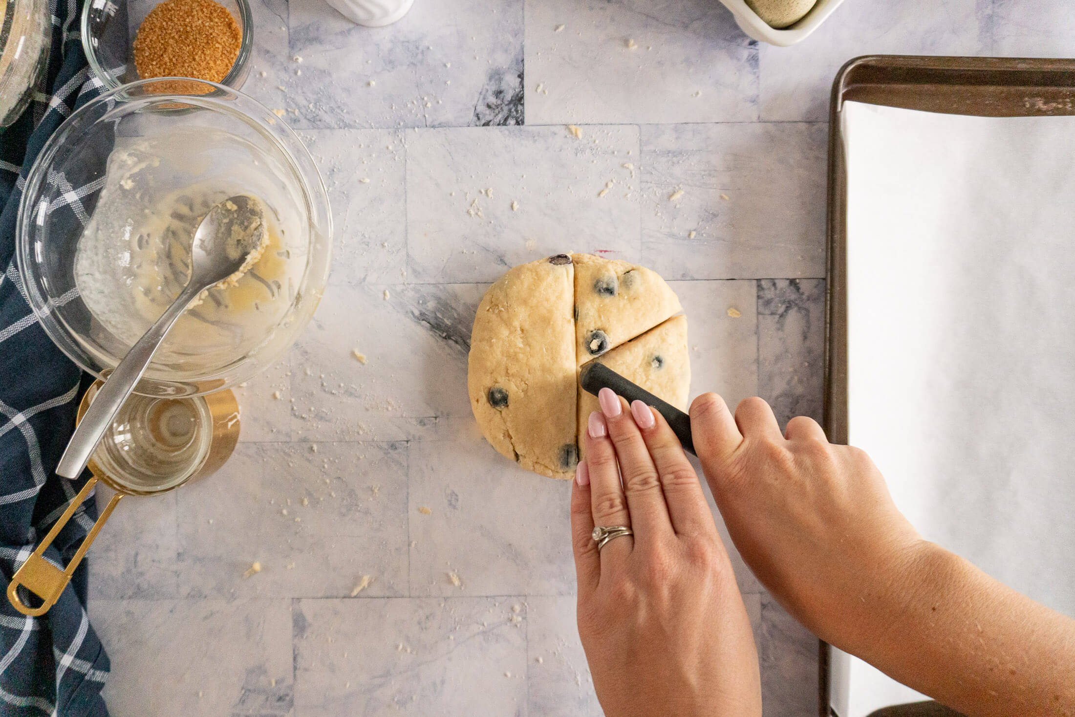 Cutting round dough into sixths.
