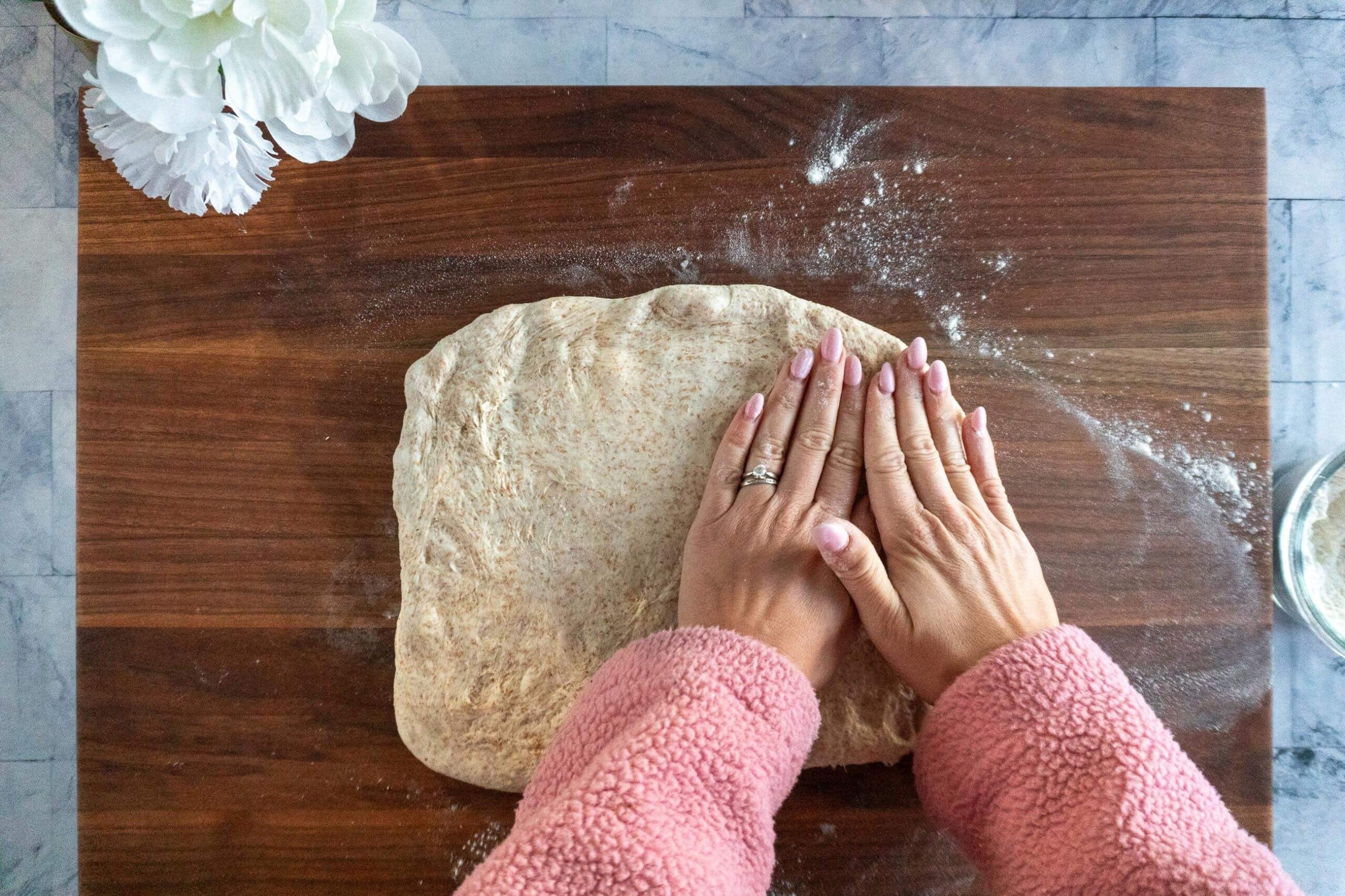 Pressing the fermented dough into a rectangle.