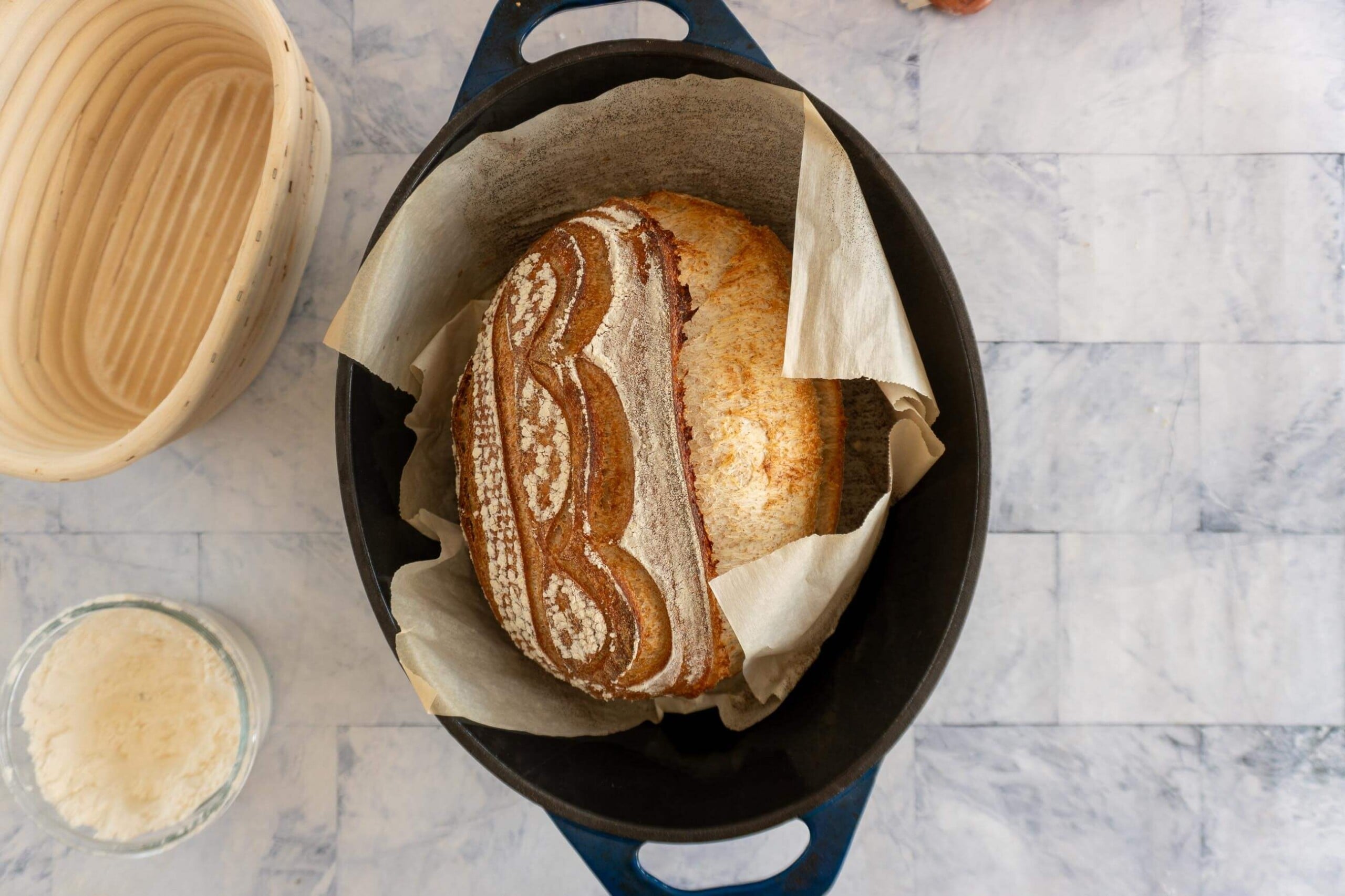 Whole wheat sourdough bread after baking in a cast iron dutch oven.