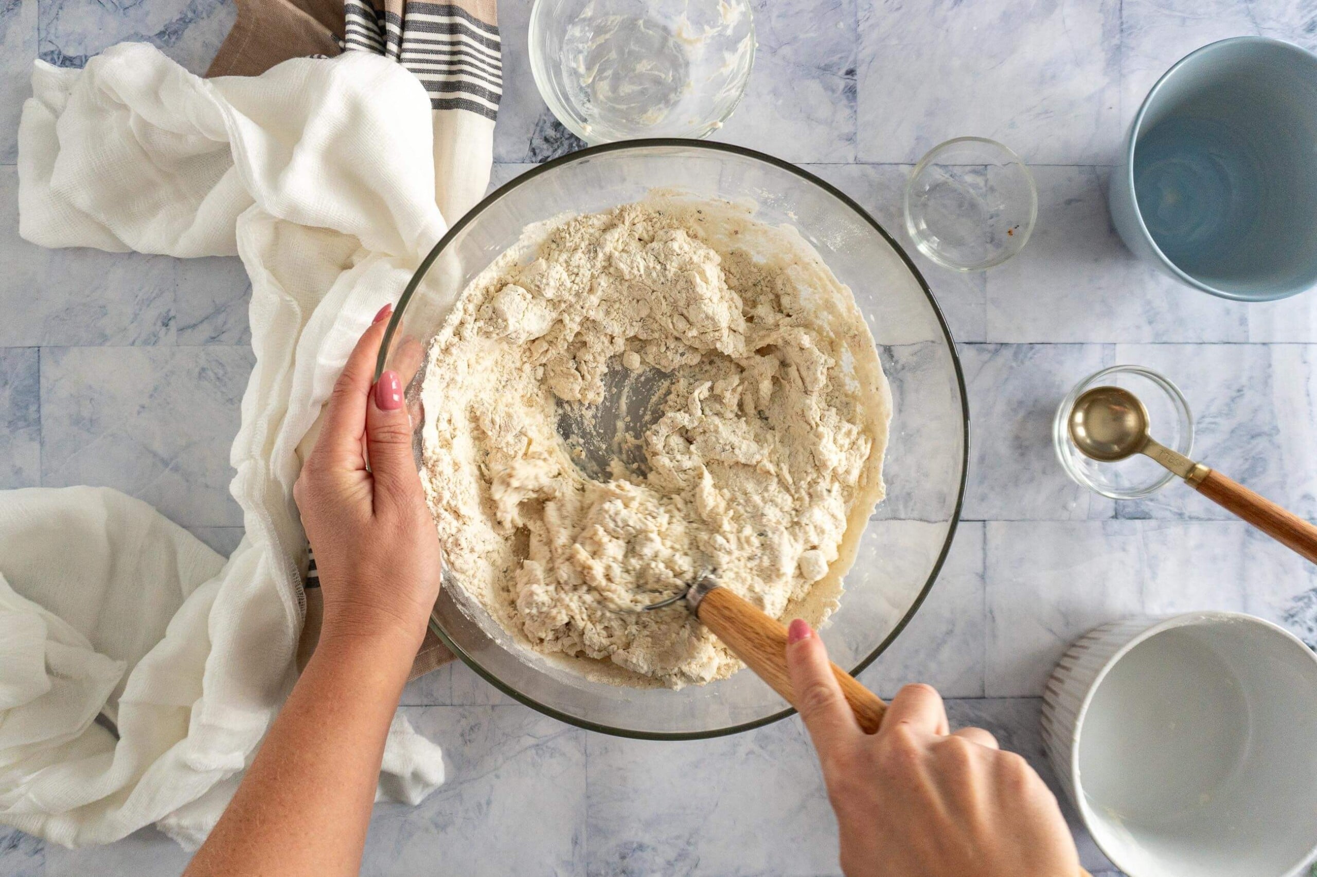 Stirring all ingredients together with a danish dough whisk. 