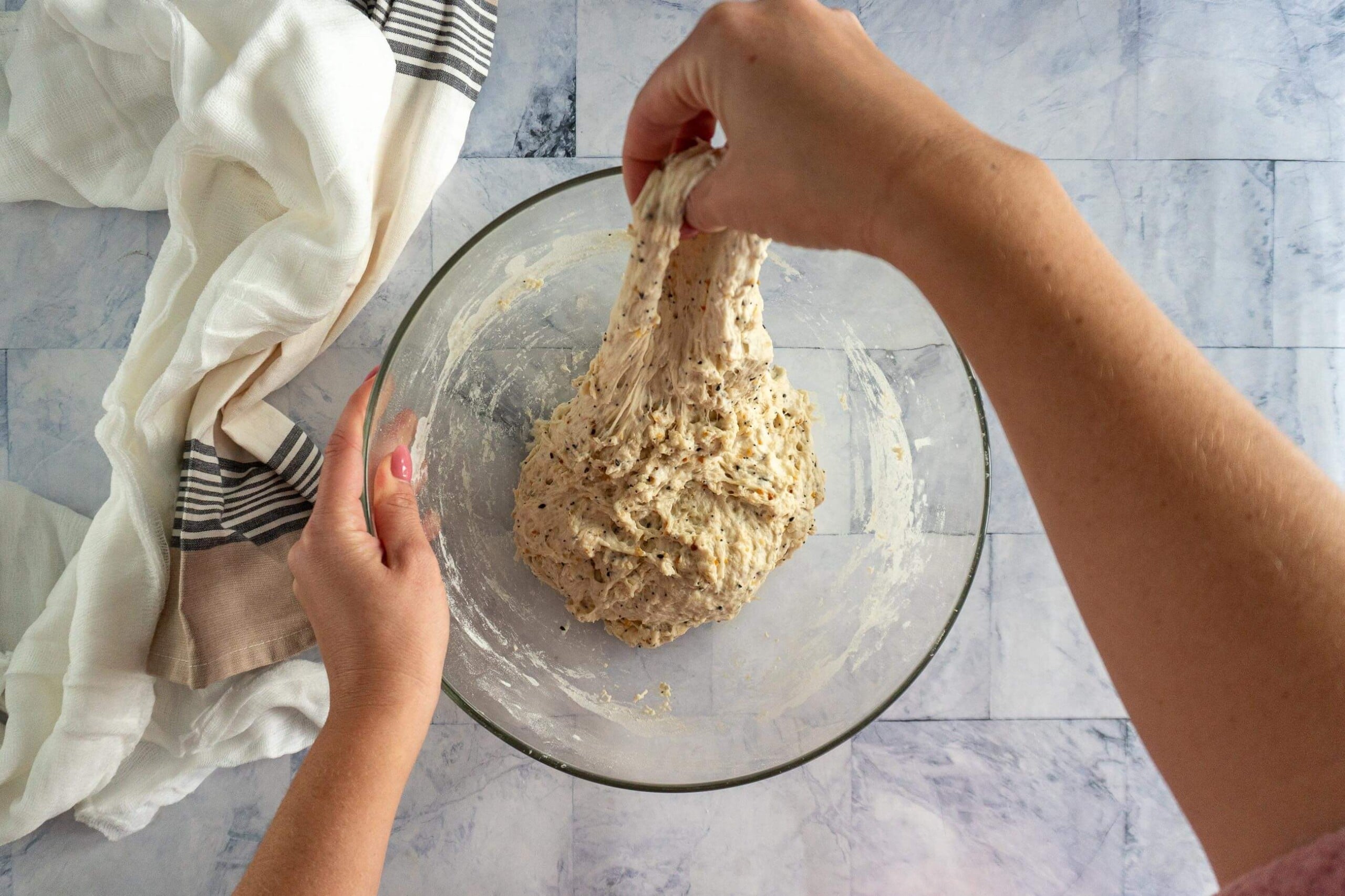 Stretching the dough upwards. 