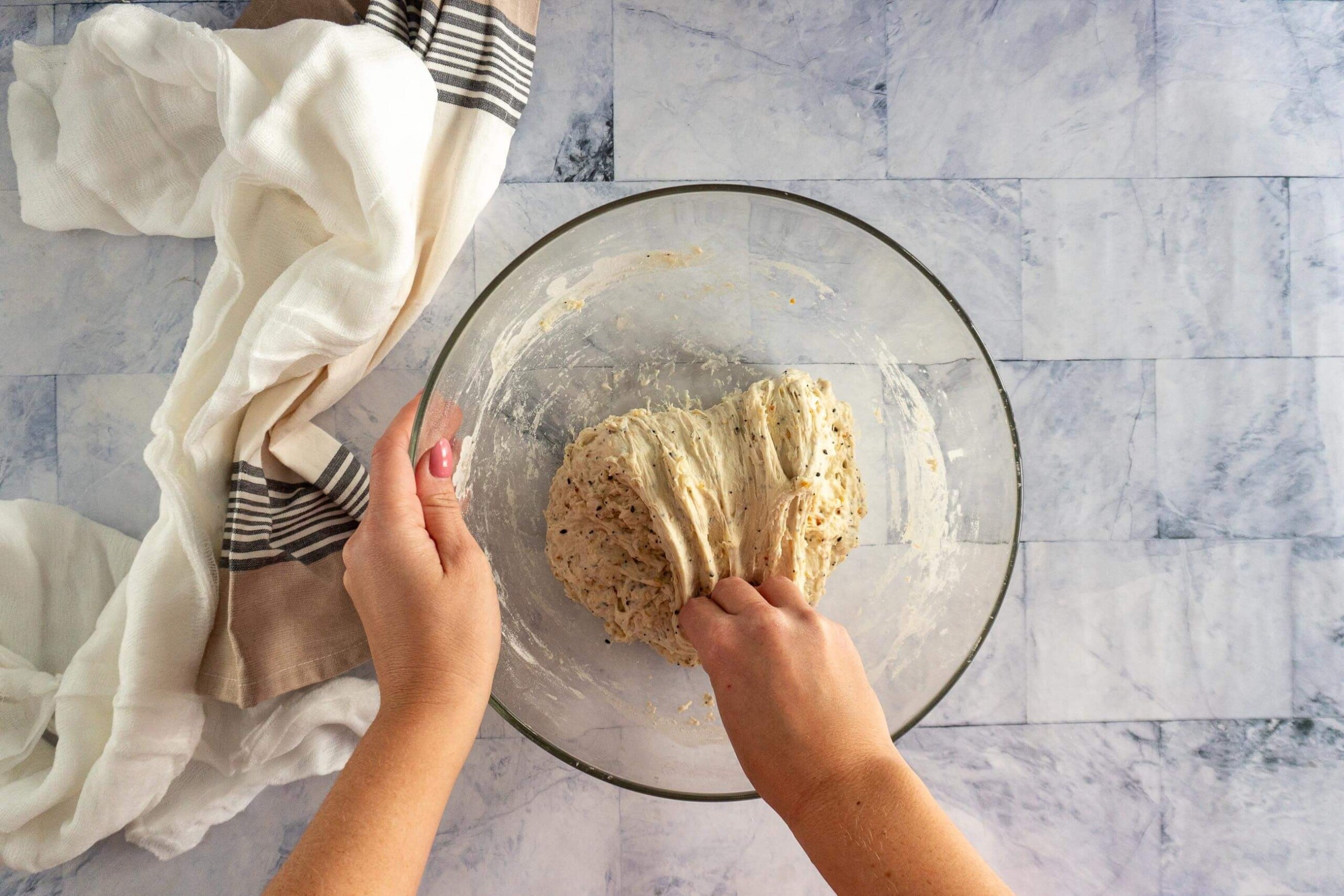Folding the dough over itself. 