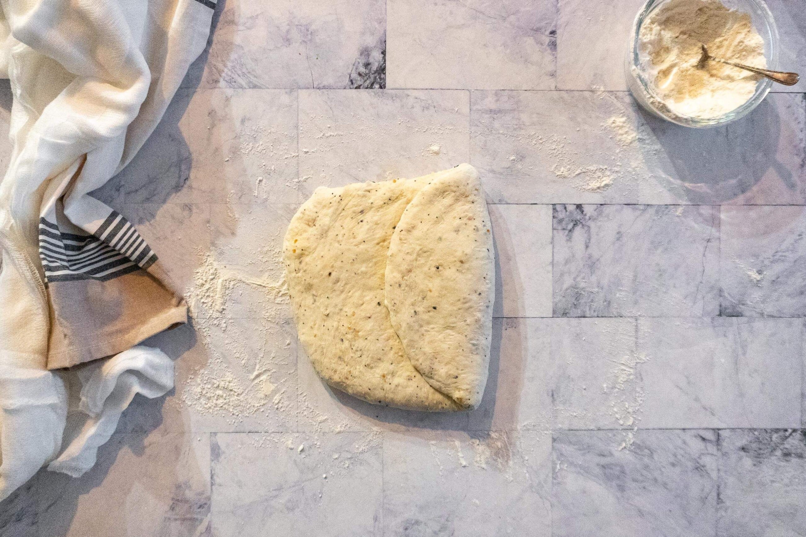 Folding the dough into thirds. 