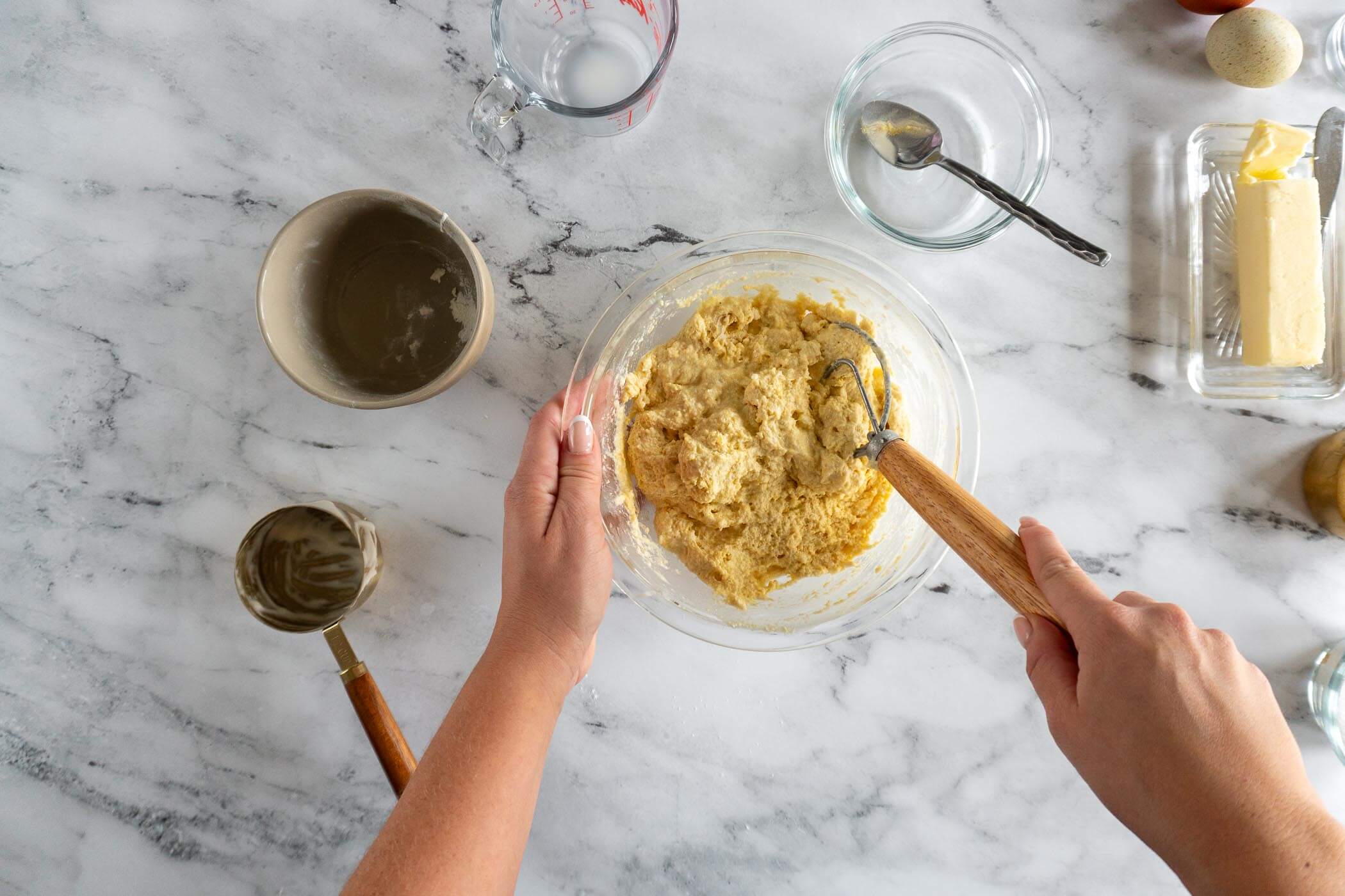Stirring the preferment together with danish dough whisk. 