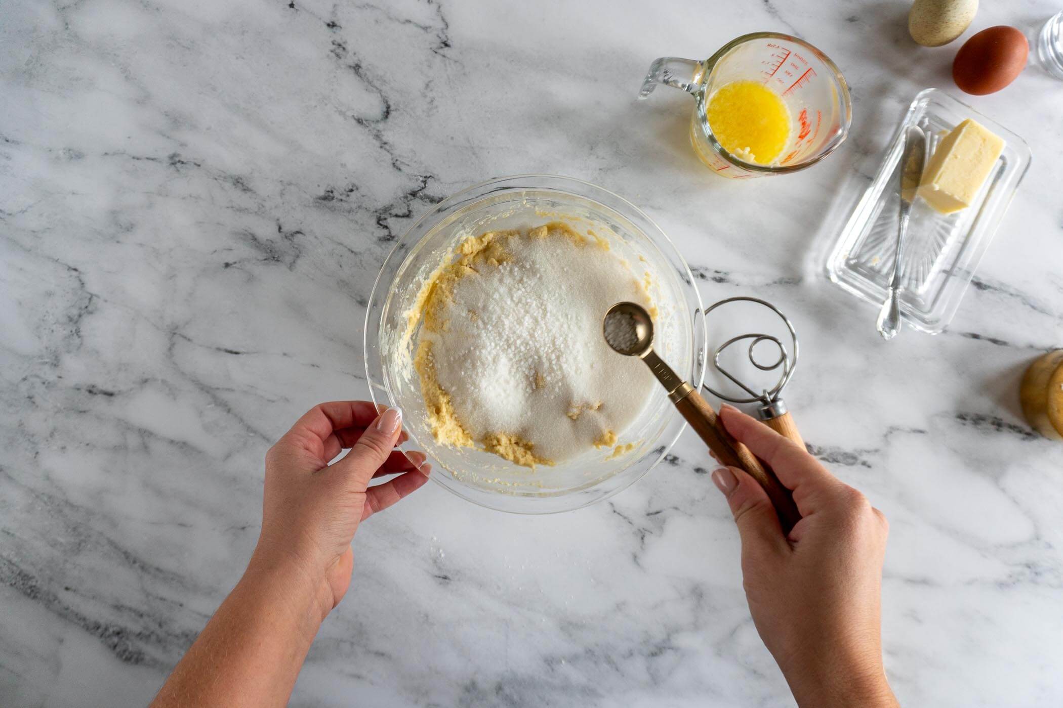Adding sugar, salt, and baking powder to preferment.