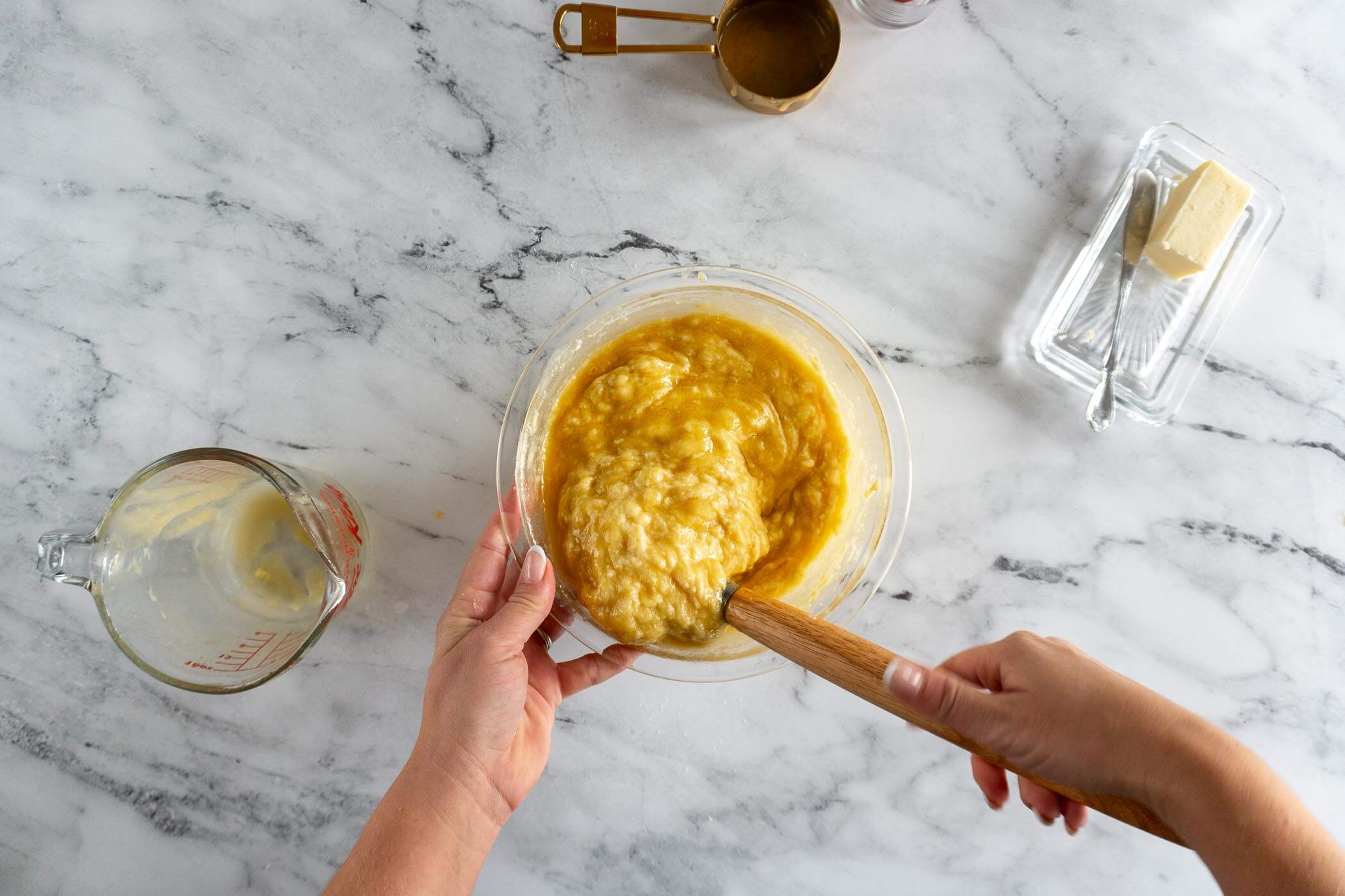 Folding the batter together until completely incorporated. 