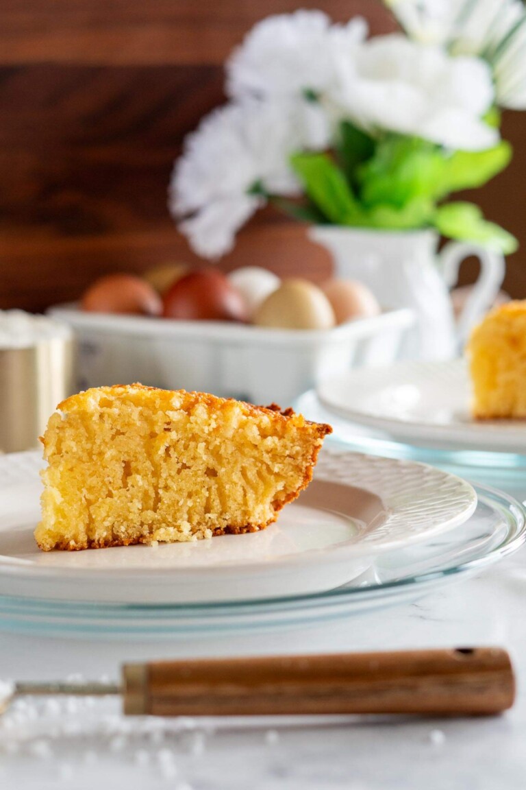 Slice of sourdough cornbread on a white plate.