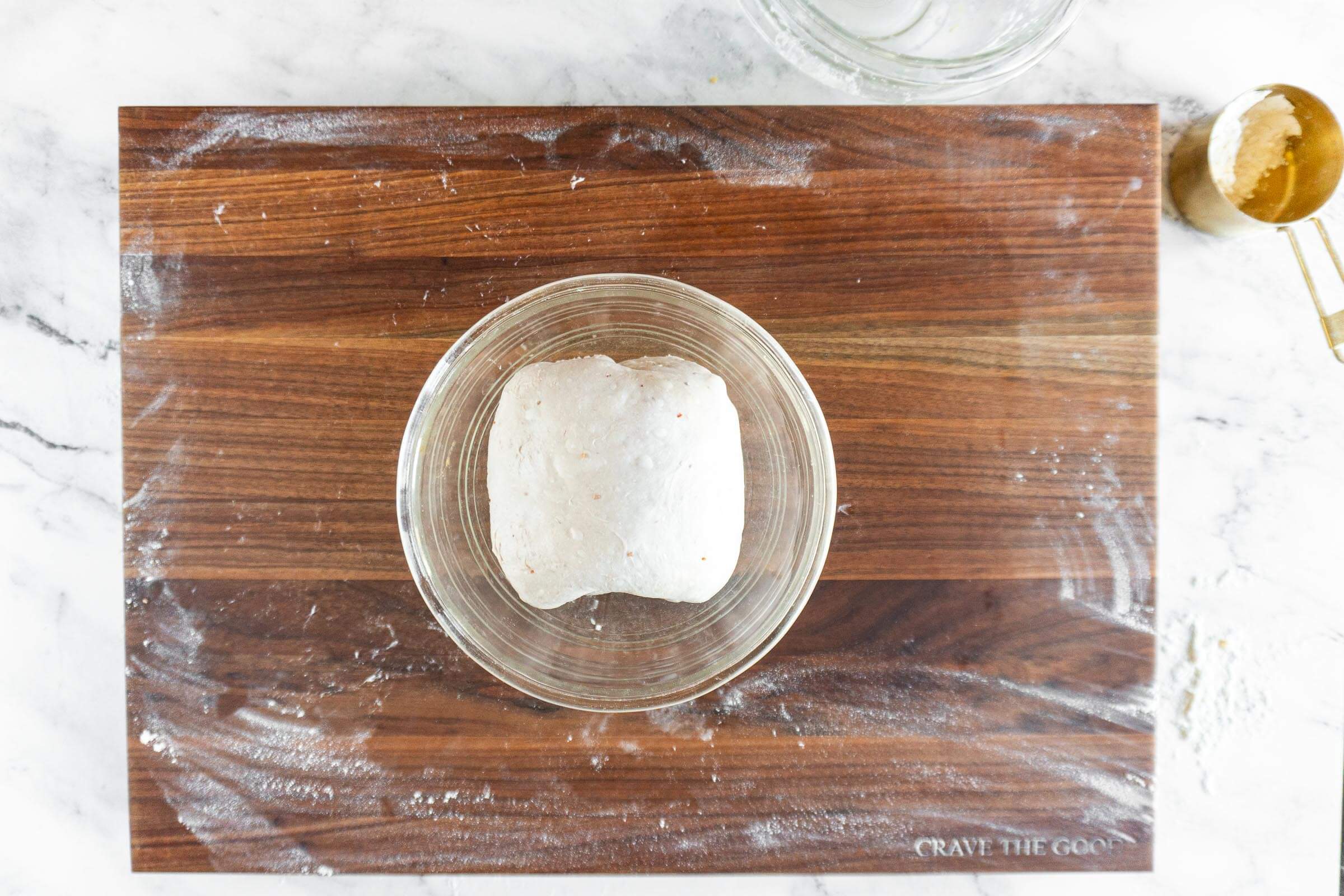 Folded dough in proofing bowl. 