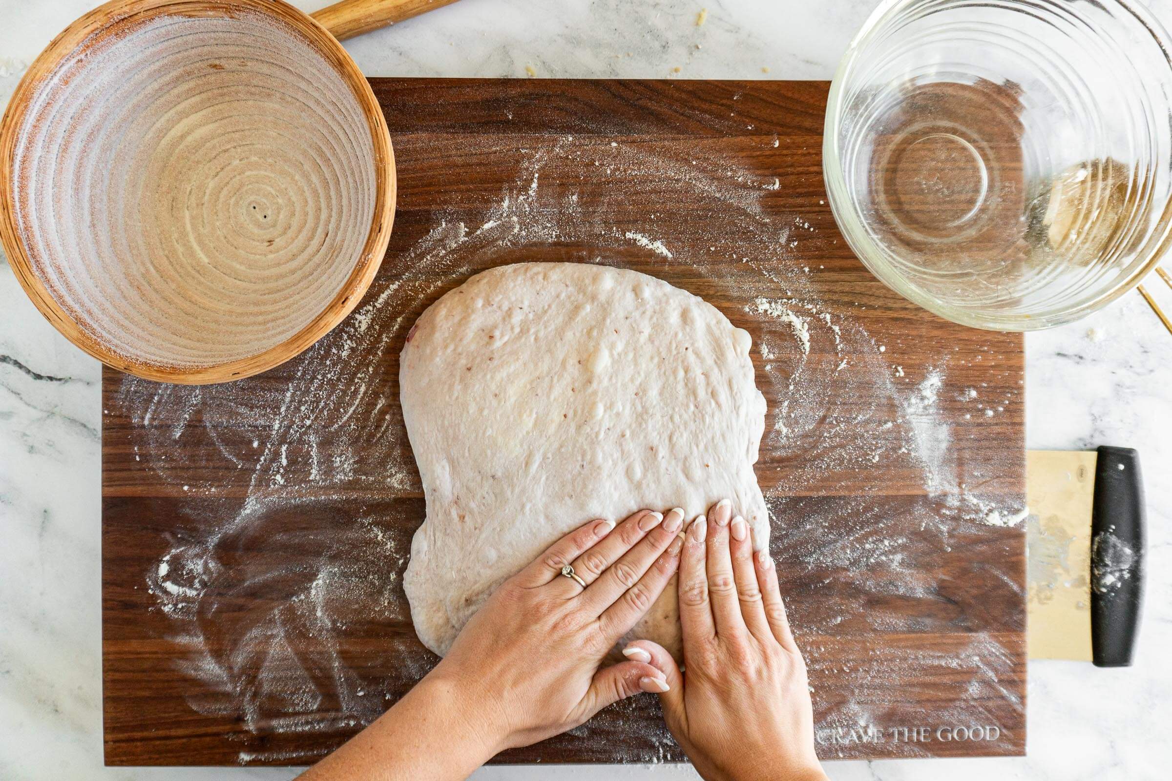 Pressing dough into a rectangle.
