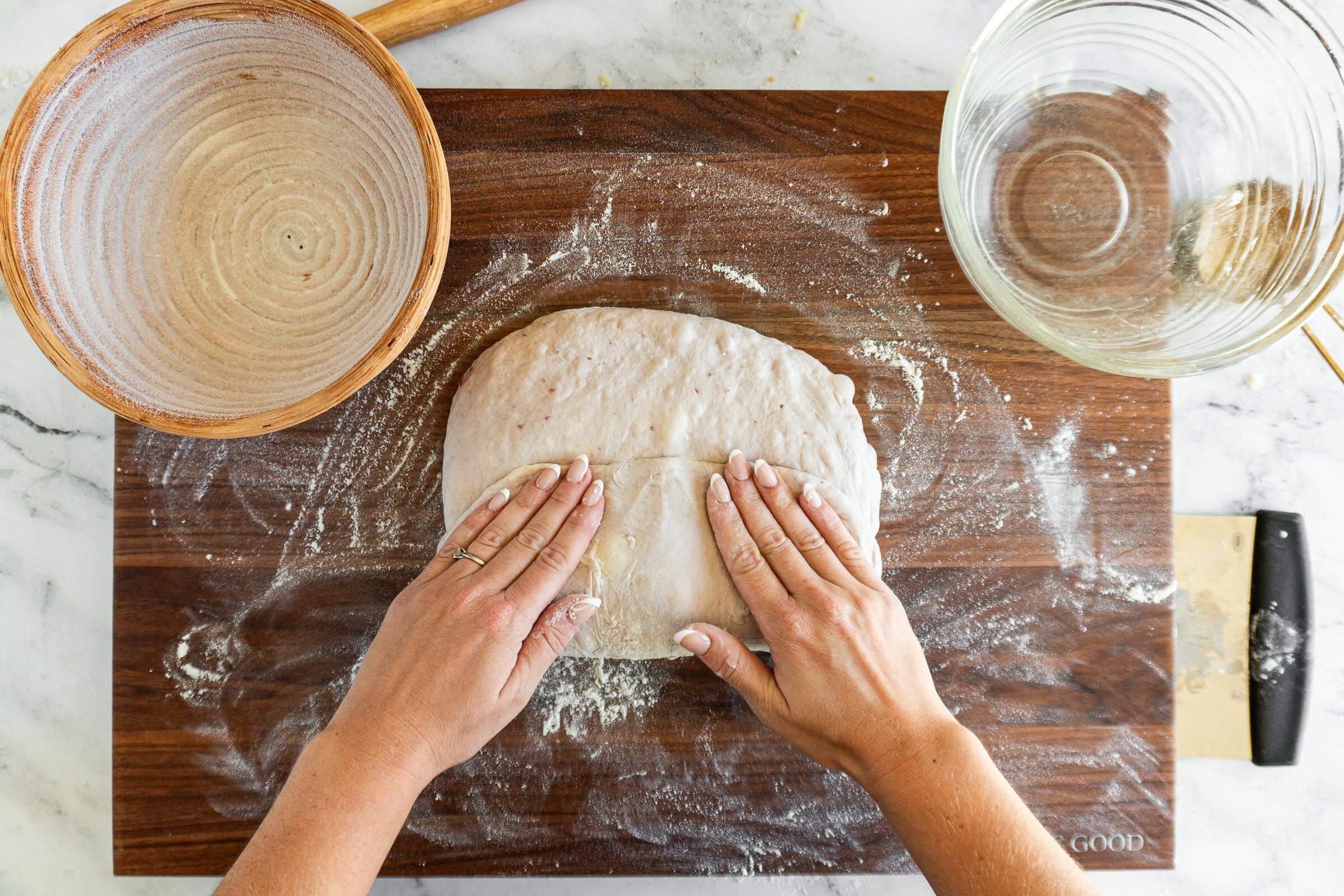 Folding up the bottom third of the dough.
