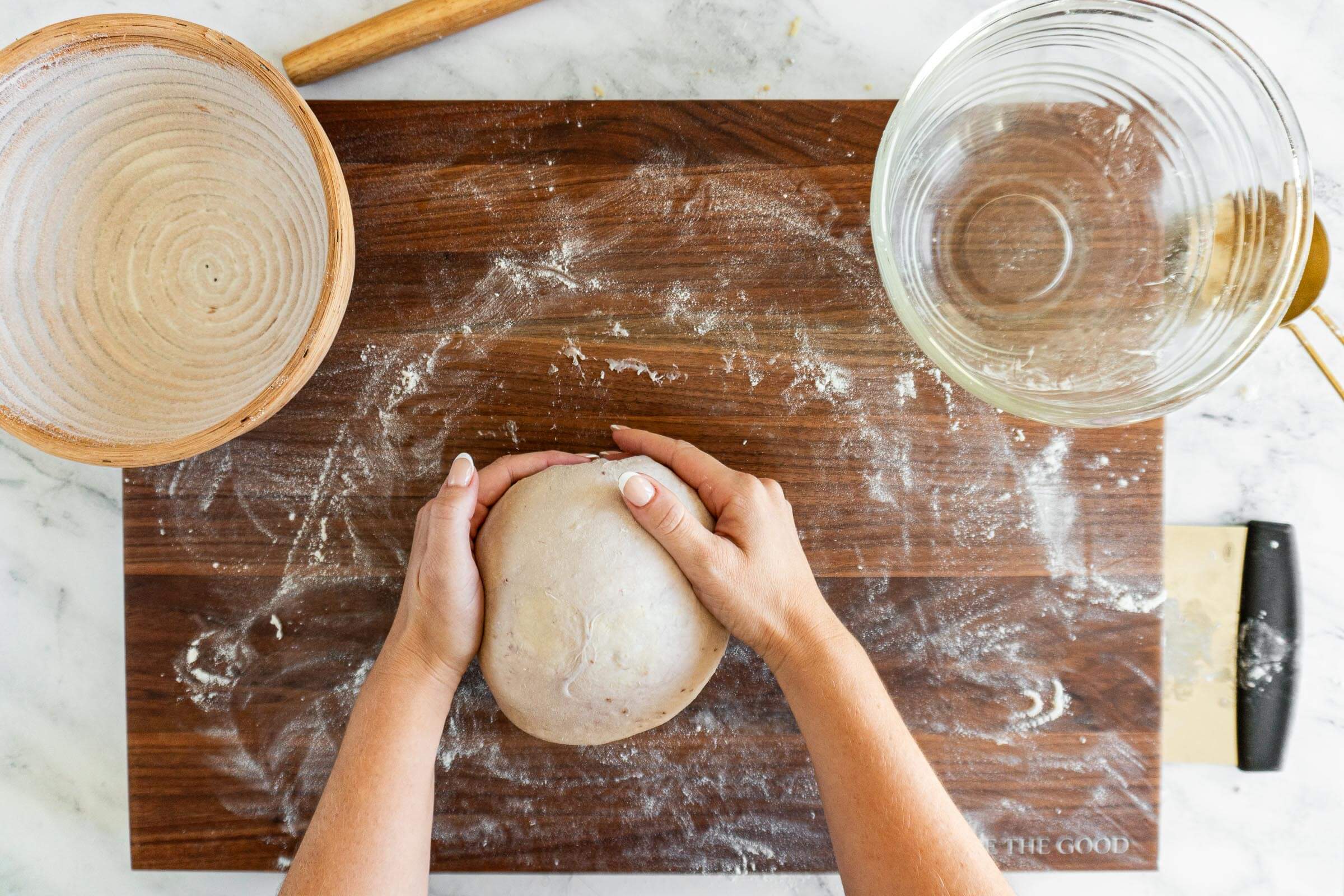 Shaping the dough into a boule.