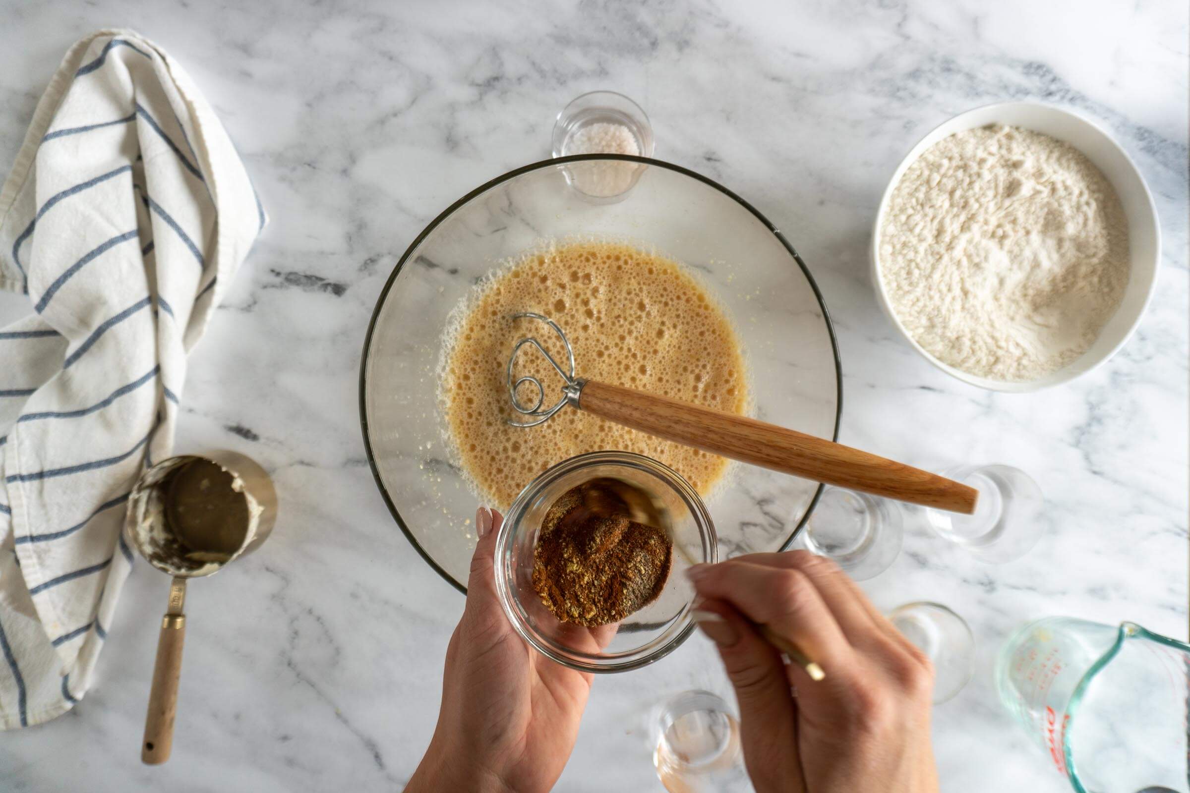 Mixing cinnamon spice blend.