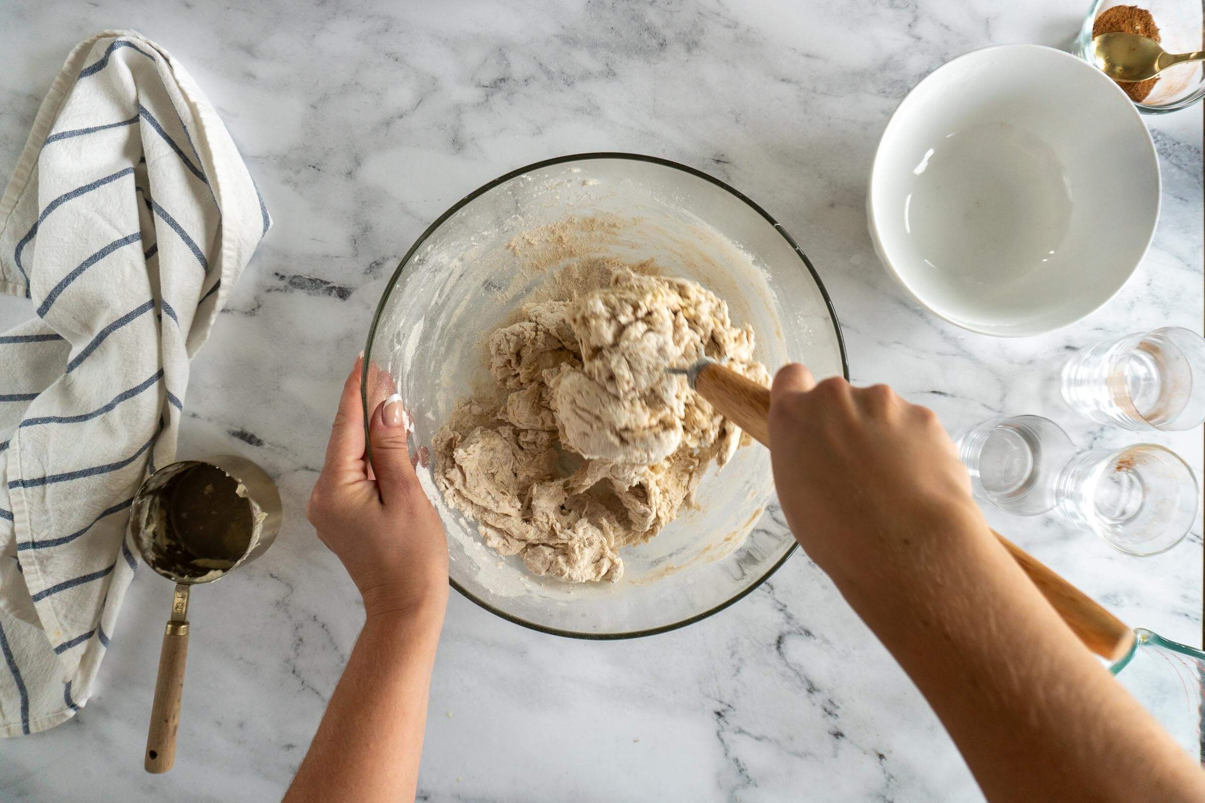 Stirring in the flour with a danish dough whisk. 