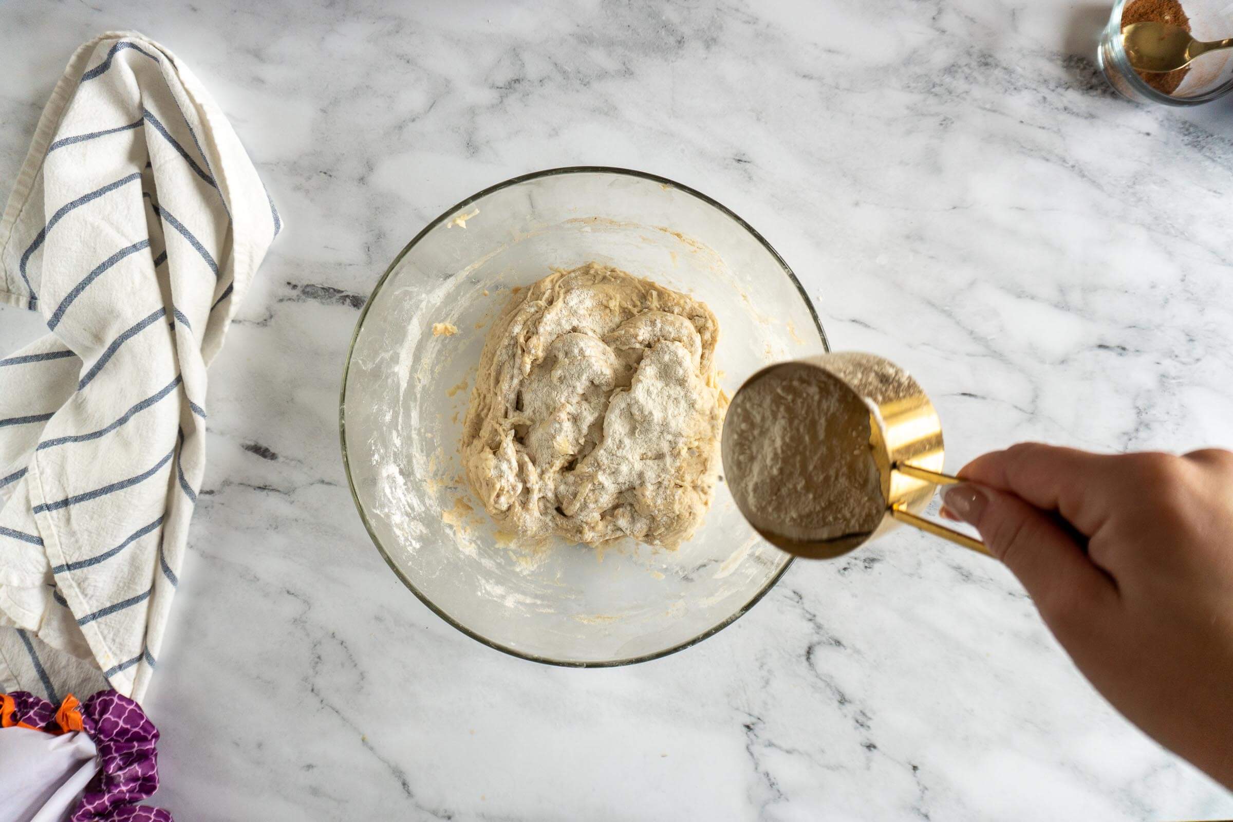 Adding flour to too wet dough. 