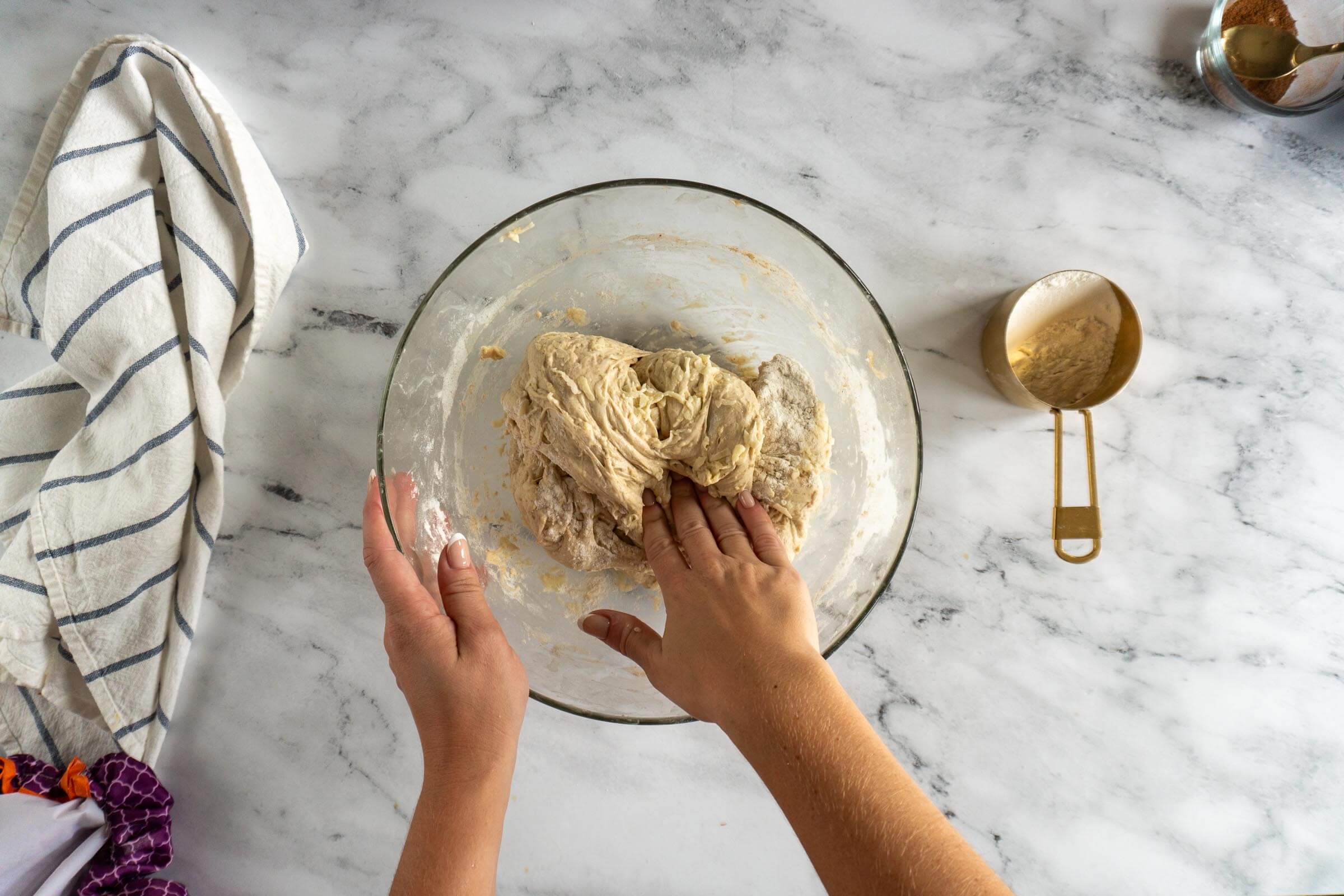 Kneading flour into wet dough with shredded apples.