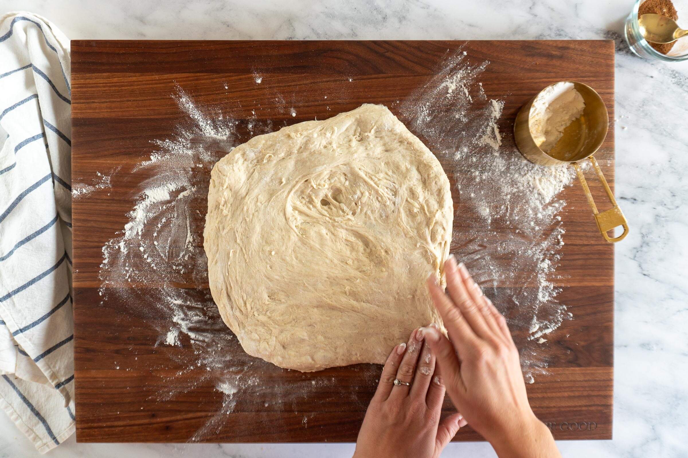 Stretching the dough into a rectangle to laminate. 