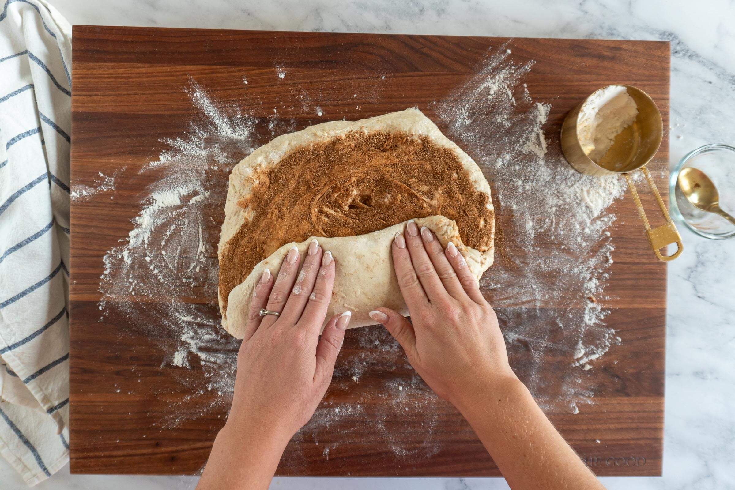 Folding up bottom third of dough.