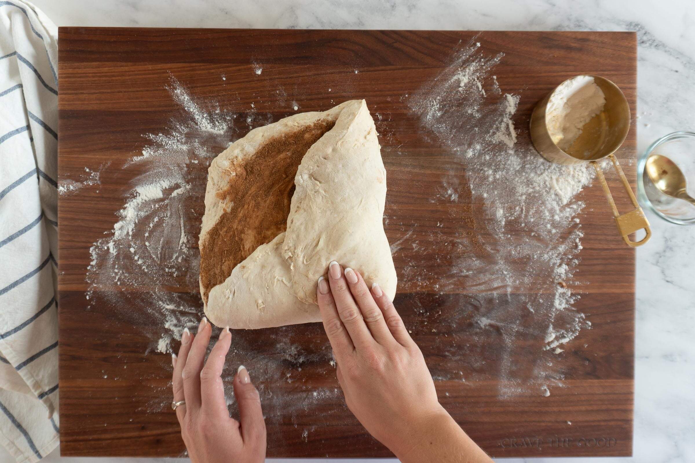 Folding in the corners of the dough.
