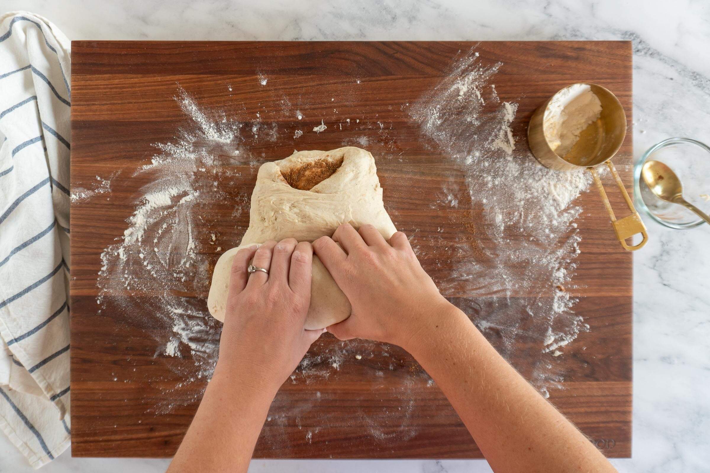 Rolling the dough into a batard.
