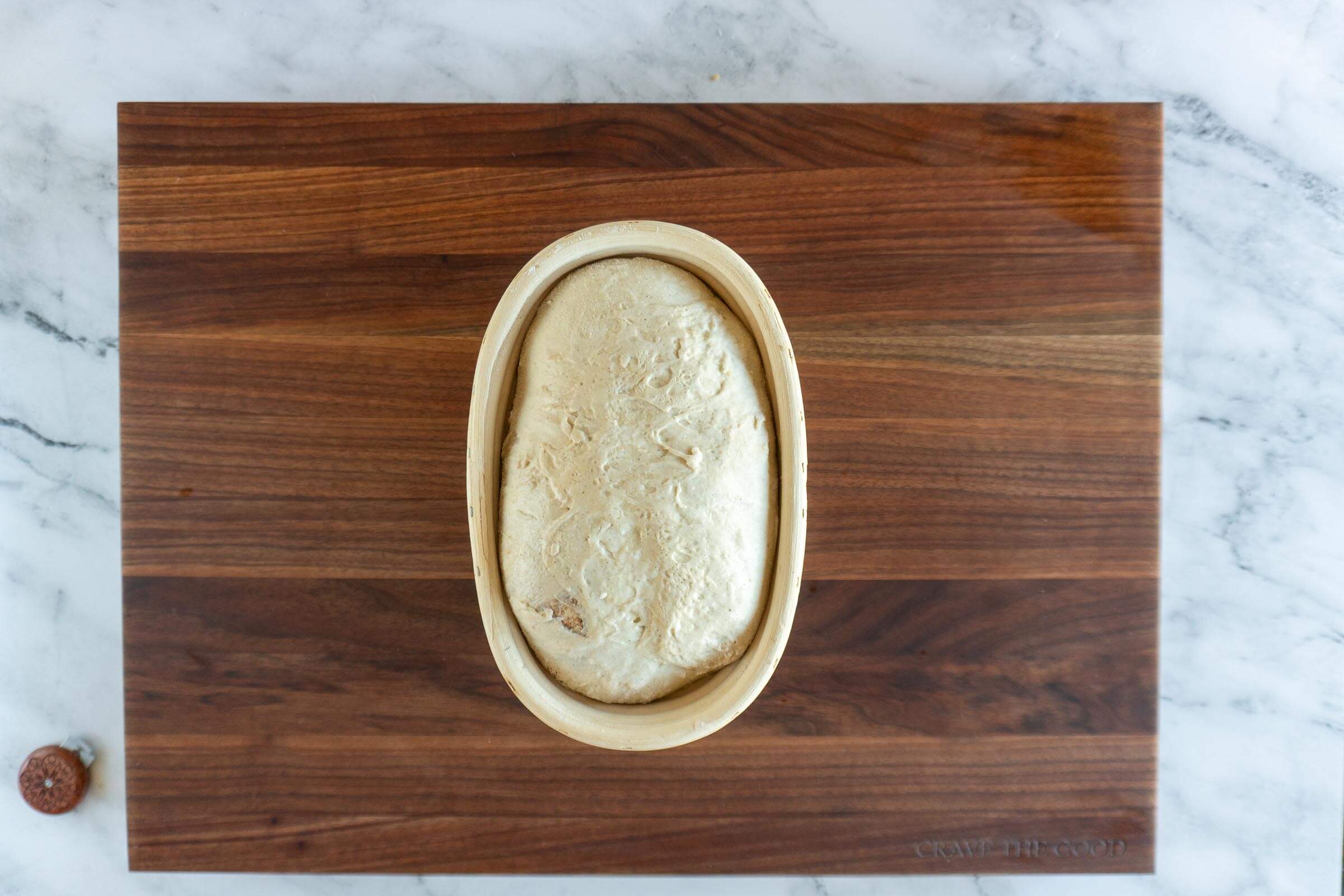 Fully proved sourdough in a banneton.