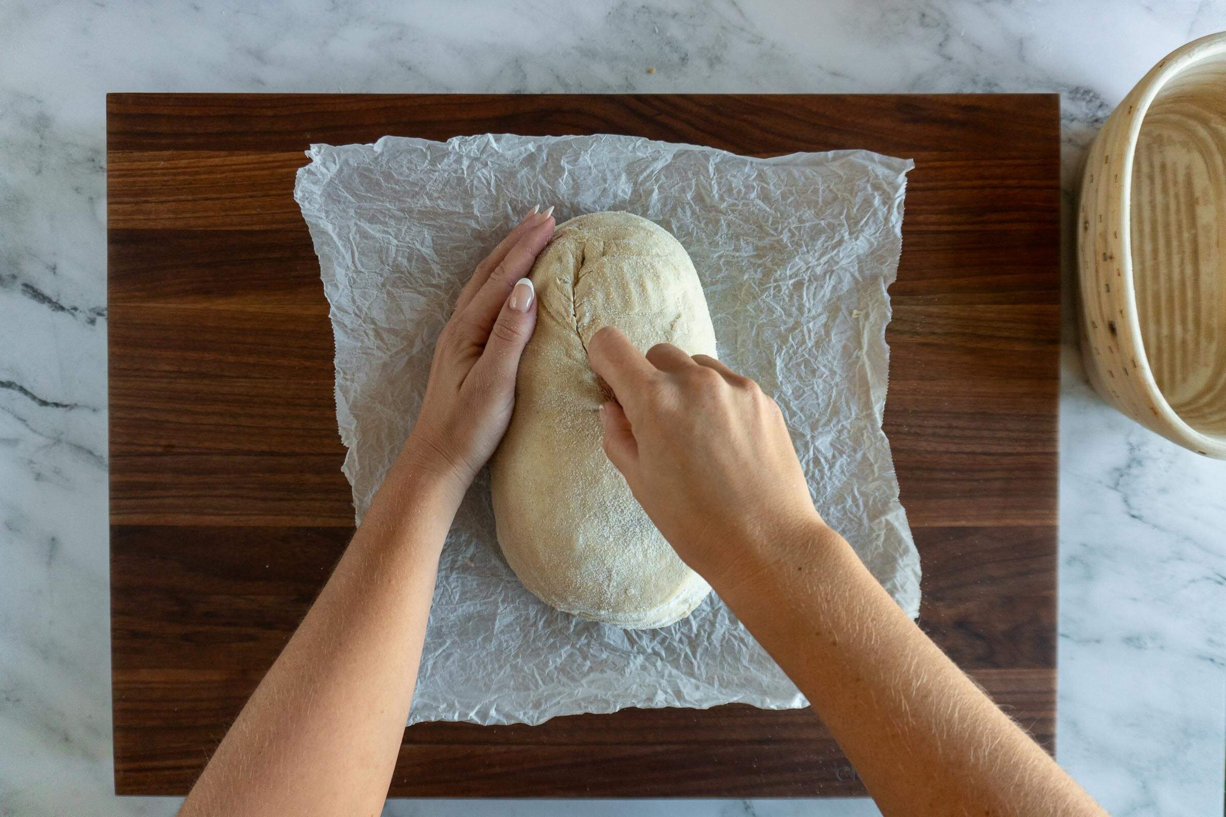 Scoring the sourdough loaf.