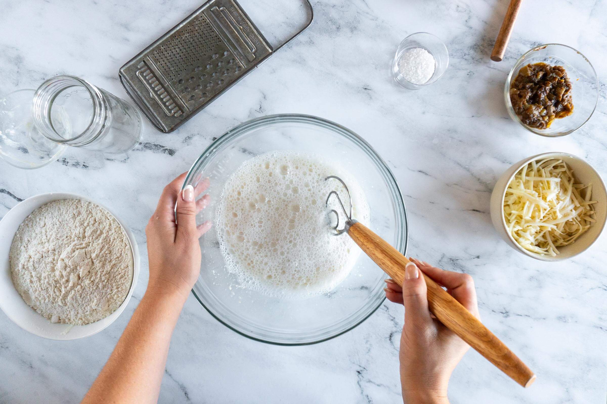 Whisking starter and water. 