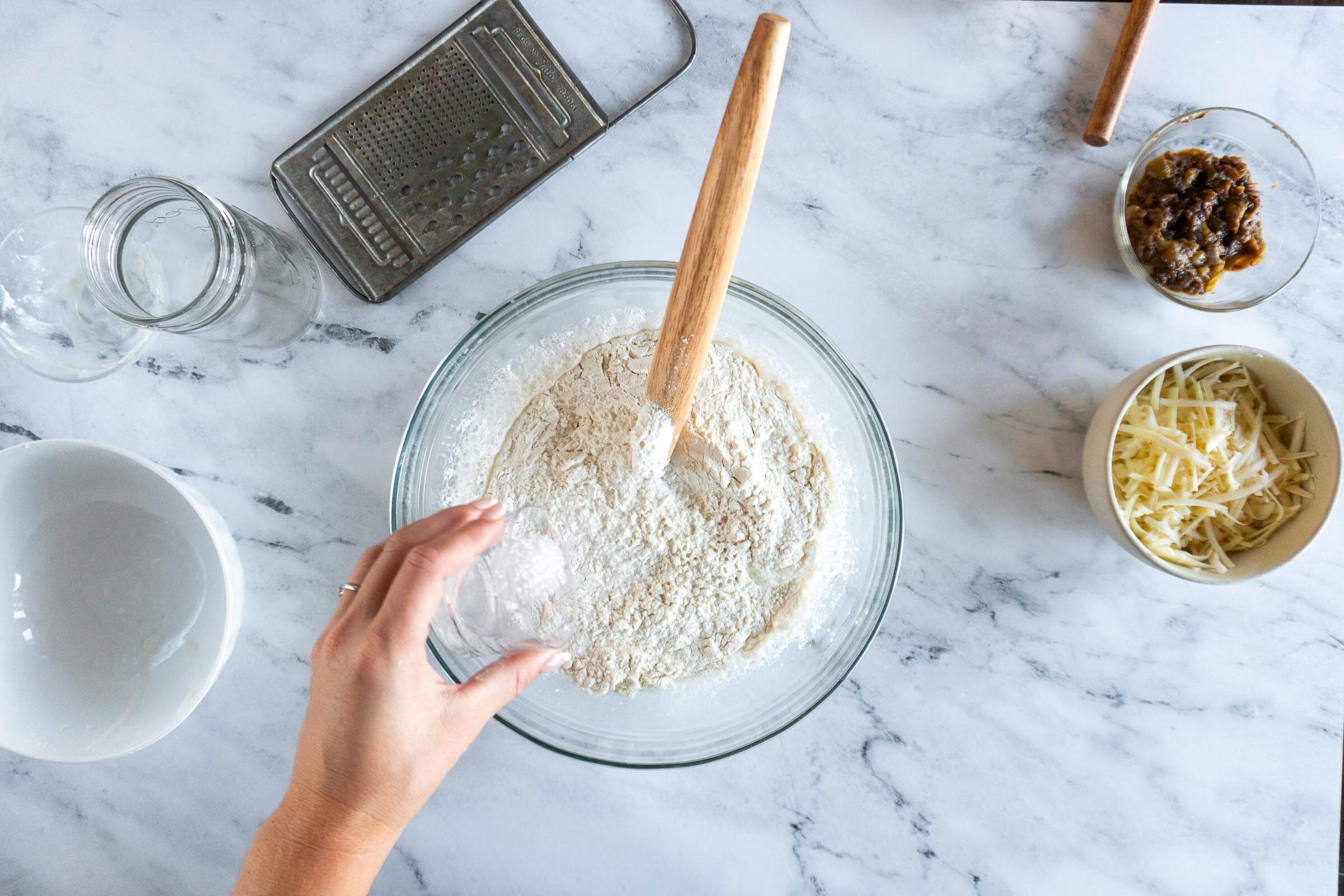 Adding flour and salt. 