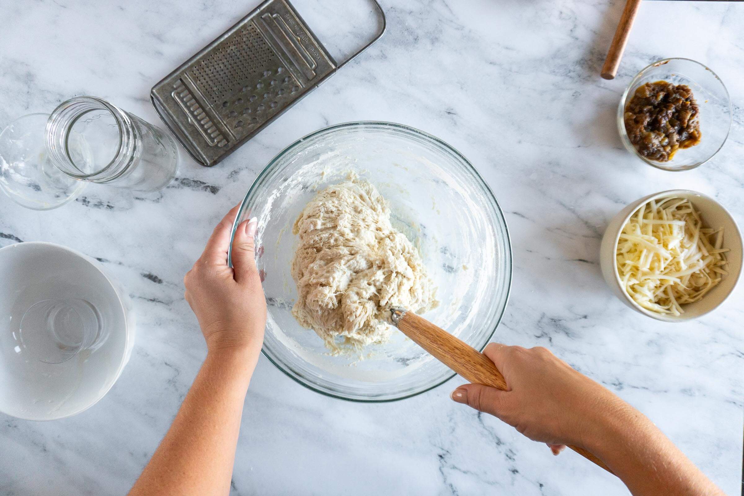 Stirring together with a dough whisk.