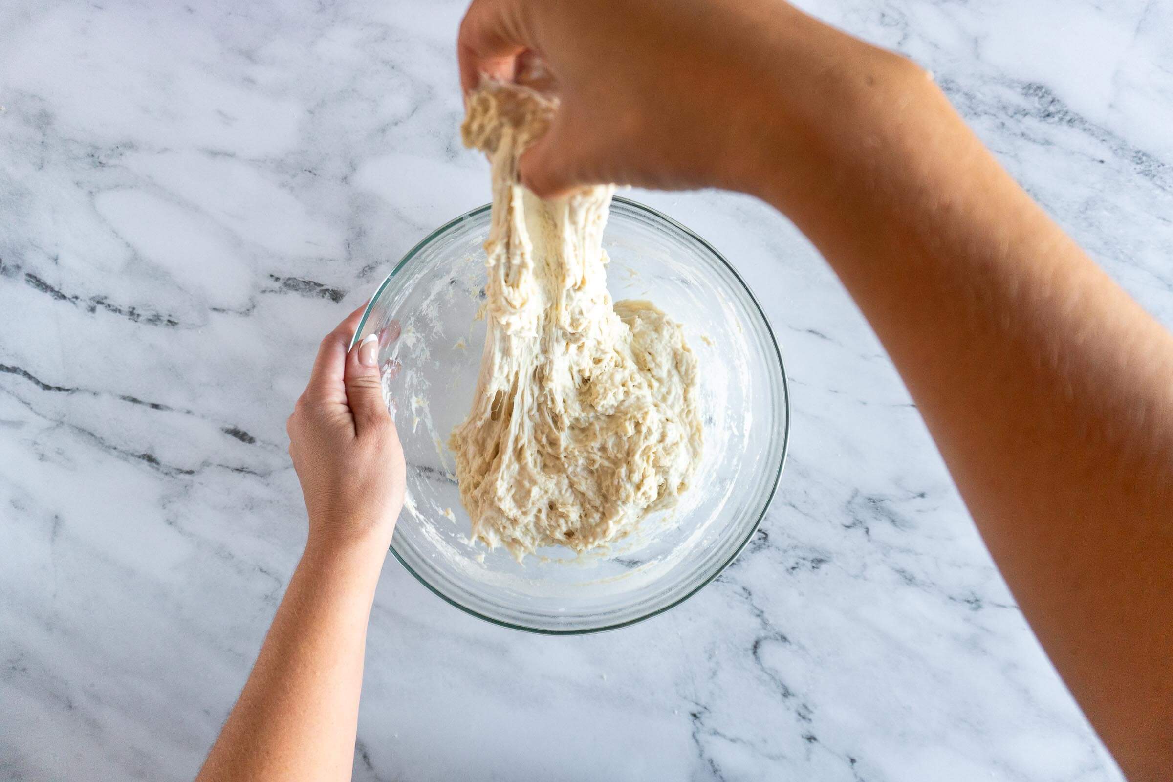 Stretching the dough. 
