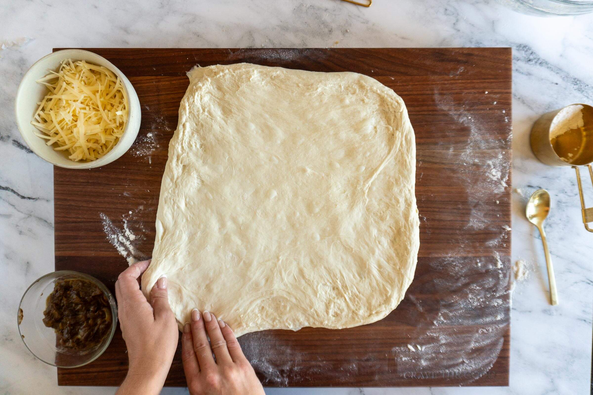 Stretching the dough to laminate. 