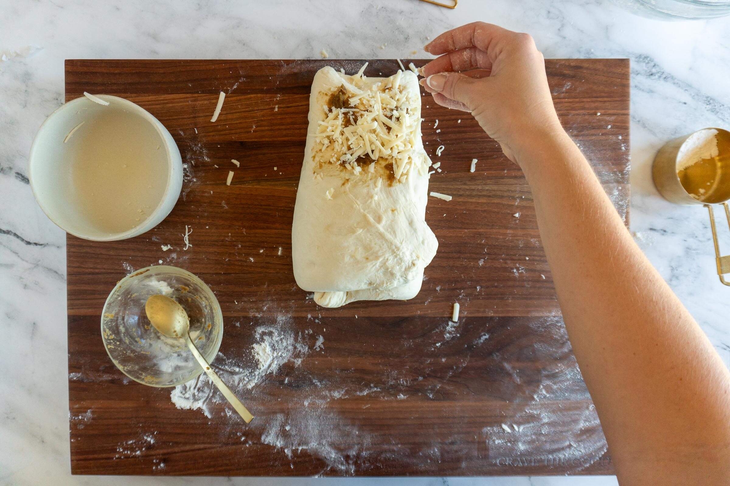 Adding remaining onions and gouda.