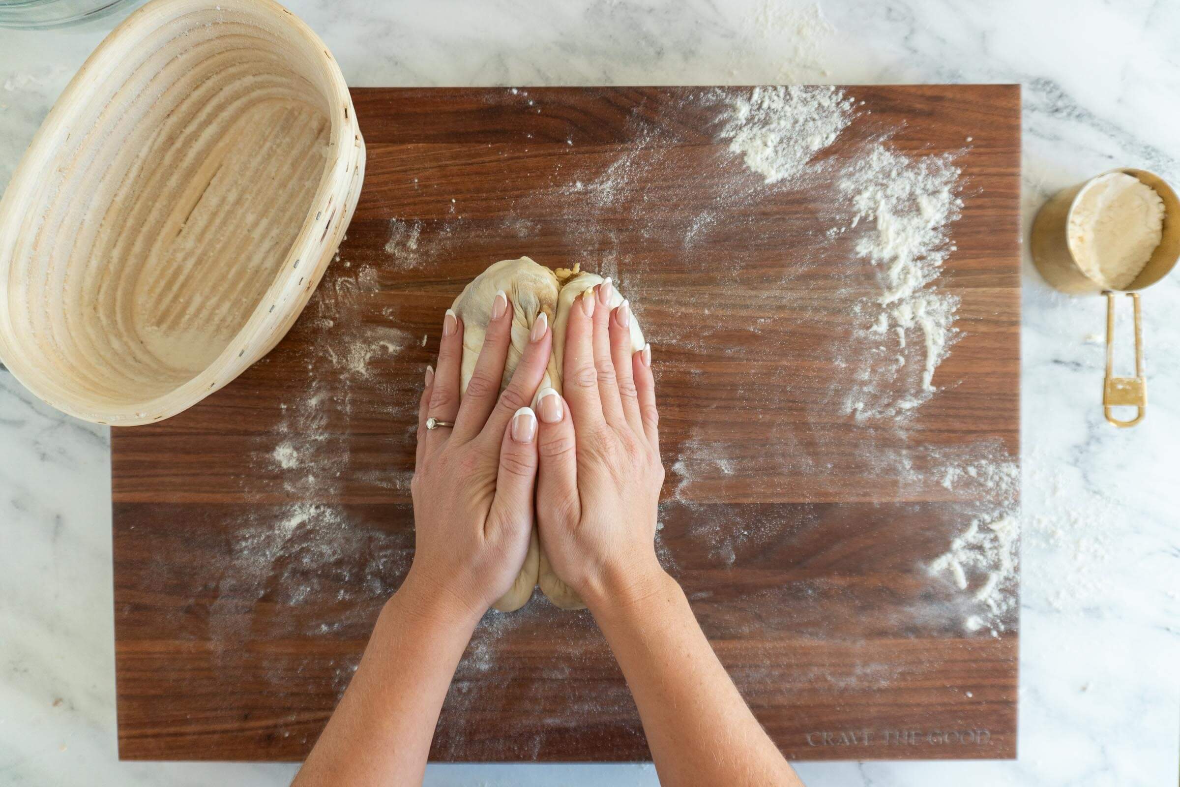 Clasping dough together.