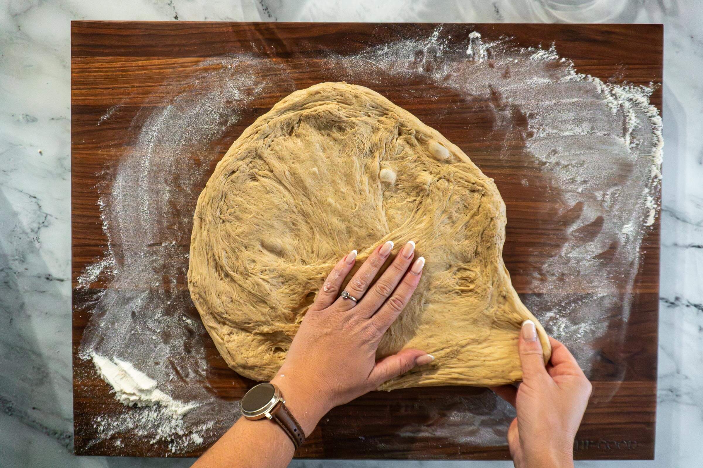 Stretching the dough into a rectangle. 