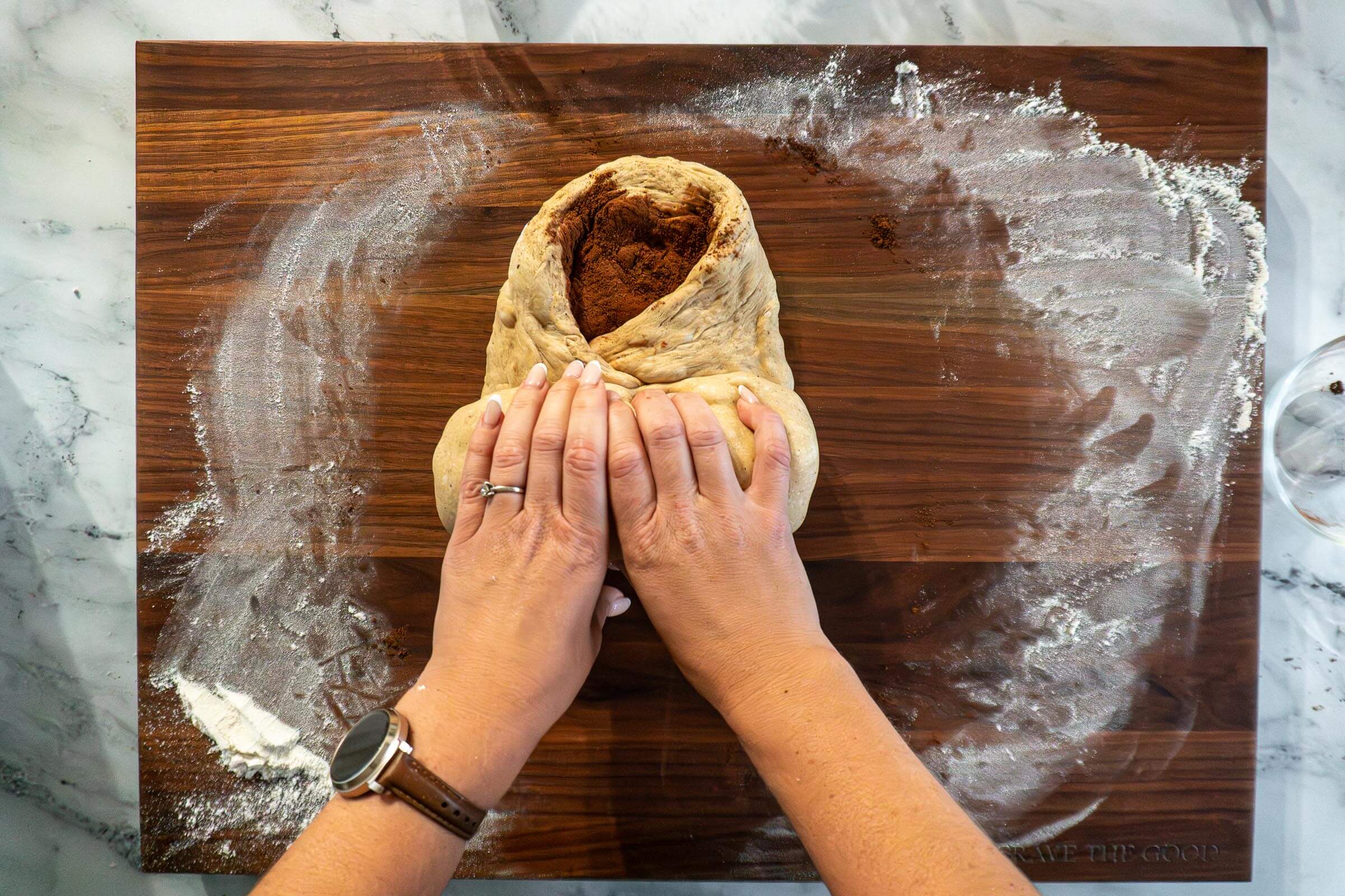 Rolling the chai sourdough into a log.
