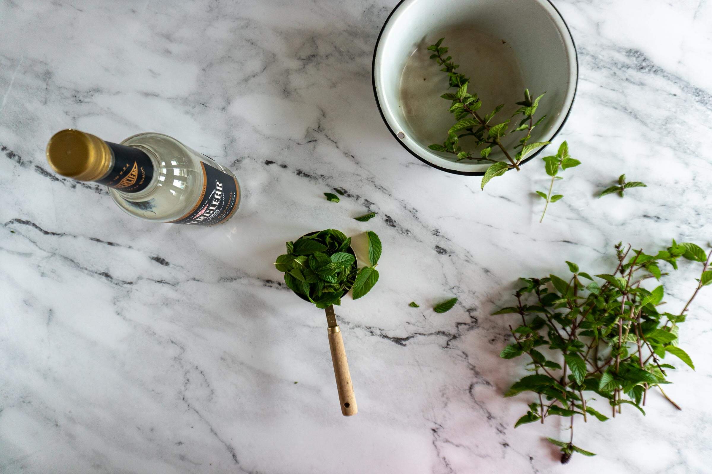 Measuring 1 cup of mint leaves.