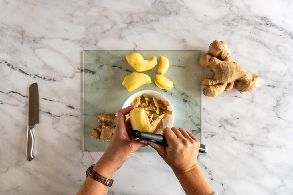 Peeling fresh ginger with euro peeler.