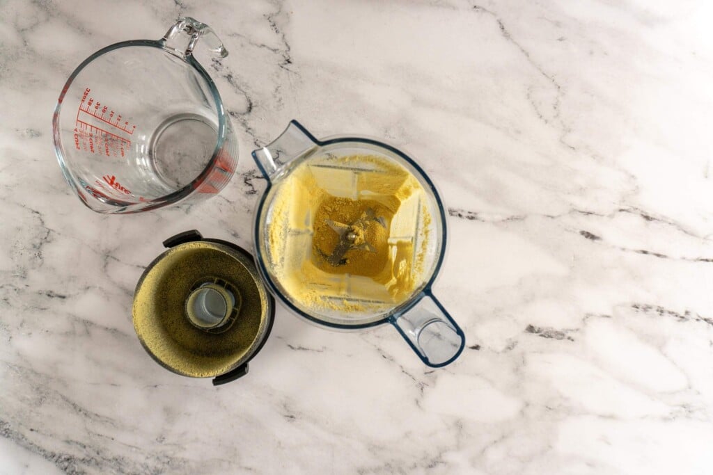 Fresh ground ginger in blender jar.