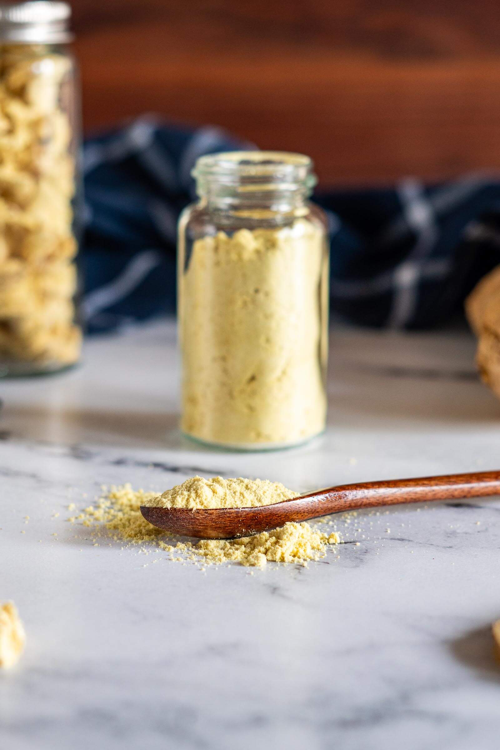 Homemade ground ginger on a wooden spoon.